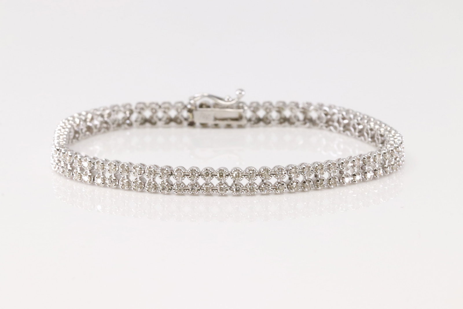 Elegant Tennis Diamond Bracelet 18Kt.: 18Kt White Gold Tennis Diamond Bracelet. This Elegant Tennis Bracelet has 146 Brilliant Diamonds. Diamonds Approx Weight: 1.50 ctw Bracelet Length: 7". Total Weight: 11.60grams.