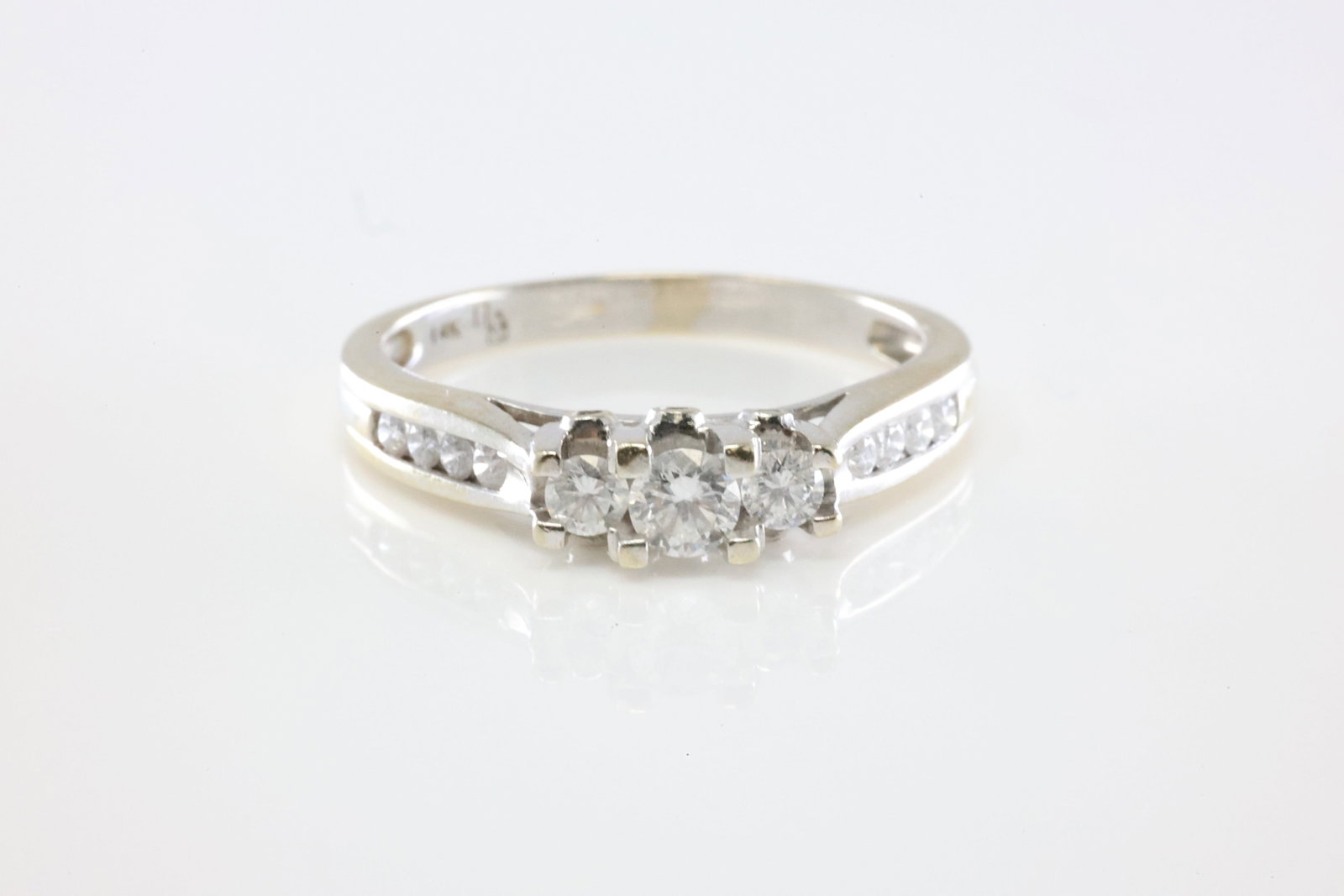 Diamond Ring 14Kt.: Ladies 14Kt White Gold Diamond Ring. This Elegant Ring has 17 Round Brilliant Diamonds. Diamond Approx Weight: 0.75ctw. Ring Size: 8.00. Total Weight: 2.76 Grams.