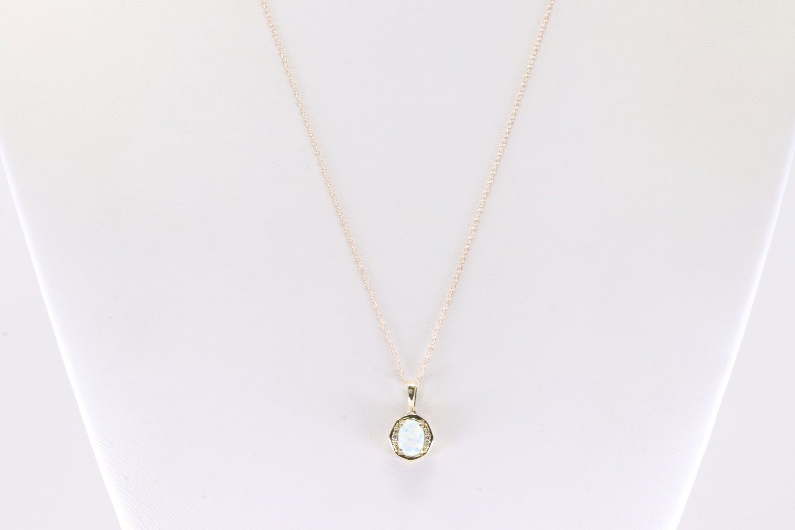 Opal & Diamond Pendant / Necklace 10Kt.: Ladies 10Kt Yellow Gold Opal & Diamond Pendant / Necklace. This Necklace has Charming Pendant with Opal And Sparkling Diamonds. Diamonds weight: 0.06ctw. Necklace length: 18.00"