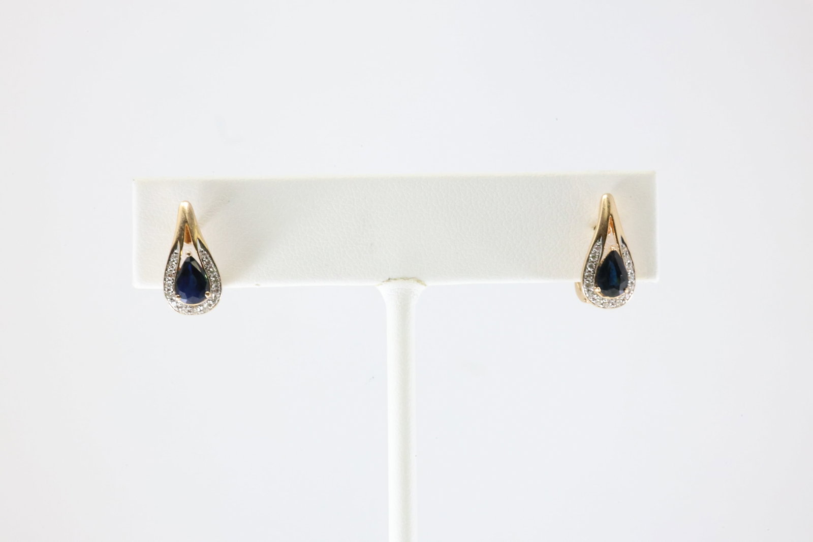 Sapphire & Diamond French Clip Earring 14Kt.: Ladies 14Kt Yellow Gold Sapphire & Diamond French Clip Earring. This Gorgeous Earring has Pear Design Sapphire Gemstone With 32 Round Sparkling Diamonds. Diamond Approx Weight: 0.25ctw. Total Weight: 
