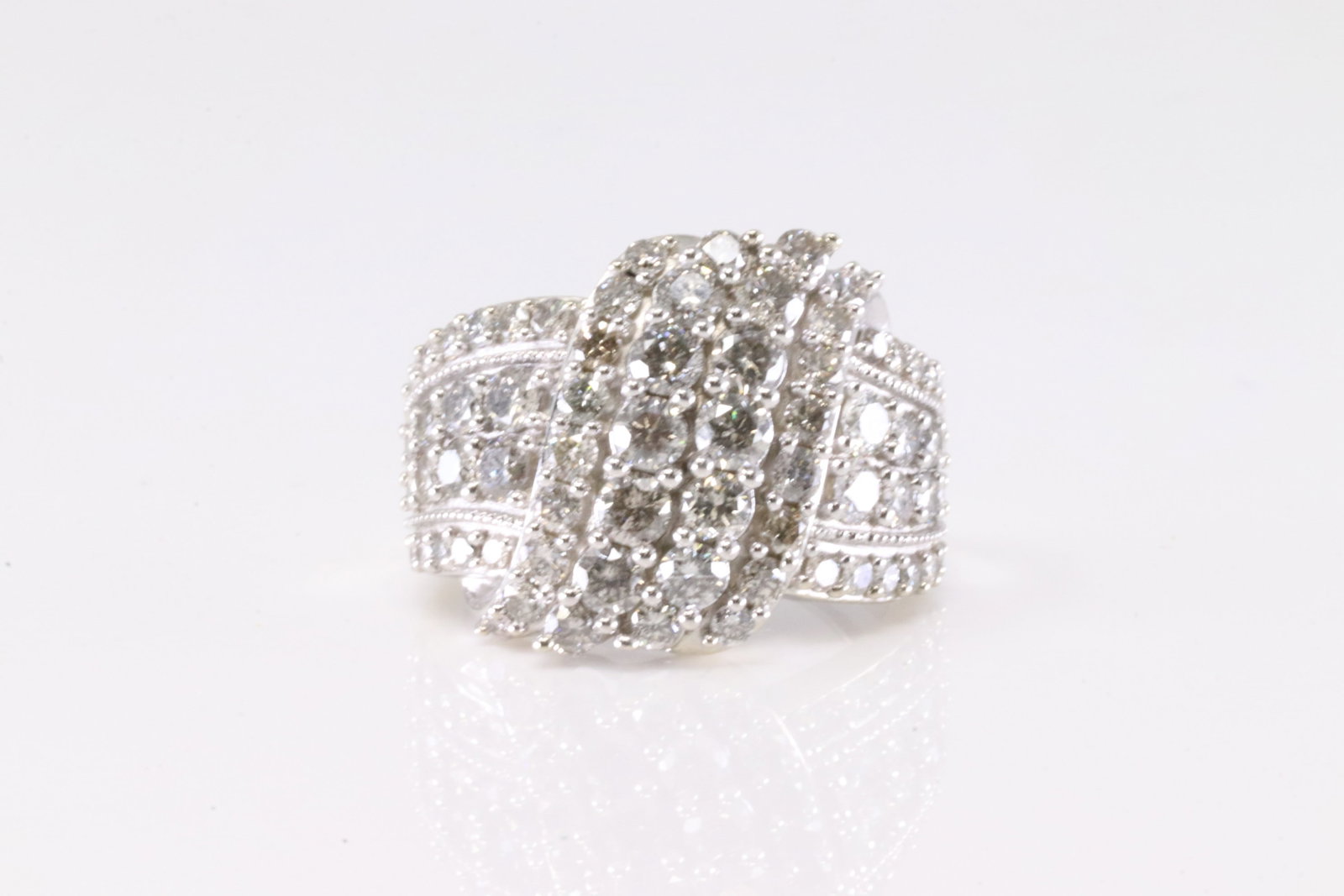 Elegant Diamond Ring 10Kt.: Ladies 10K White Gold Diamond Ring. This Elegant Ring has 78 Brilliants Diamonds. Diamonds wieght approx: 1.80 ctw Ring size: 7.00. Total weight: 7.60 Grams.