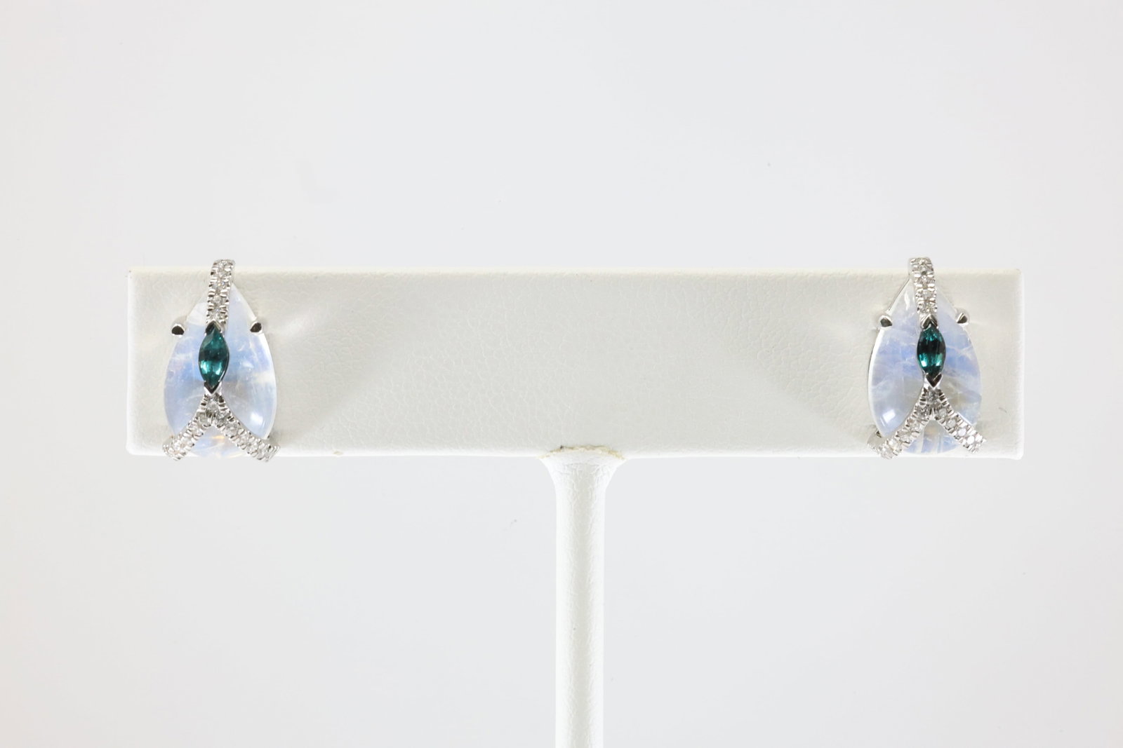 London Blue Topaz / White Stone & Diamond Stud Earring 18Kt.: Ladies 18Kt White Gold London Blue Topaz / White Stone & Diamond Stud Earring . This Elegant Stud Earring has Marquise London Topaz with Sparkling Diamonds and White Stone. Total weight: 4.58 Grams.