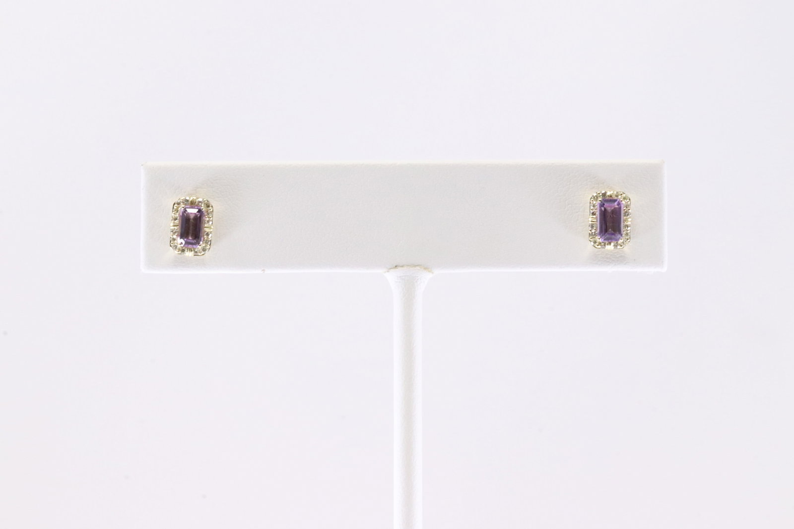 Purple Amethyst & Diamond Stud Earring 10Kt.: Ladies 10Kt Yellow Gold Purple Amethyst & Diamond Stud Earring. This Charming Stud Earring's has Purple Amethyst with Sparkling Diamonds. Diamonds weight: 0.15ctw.