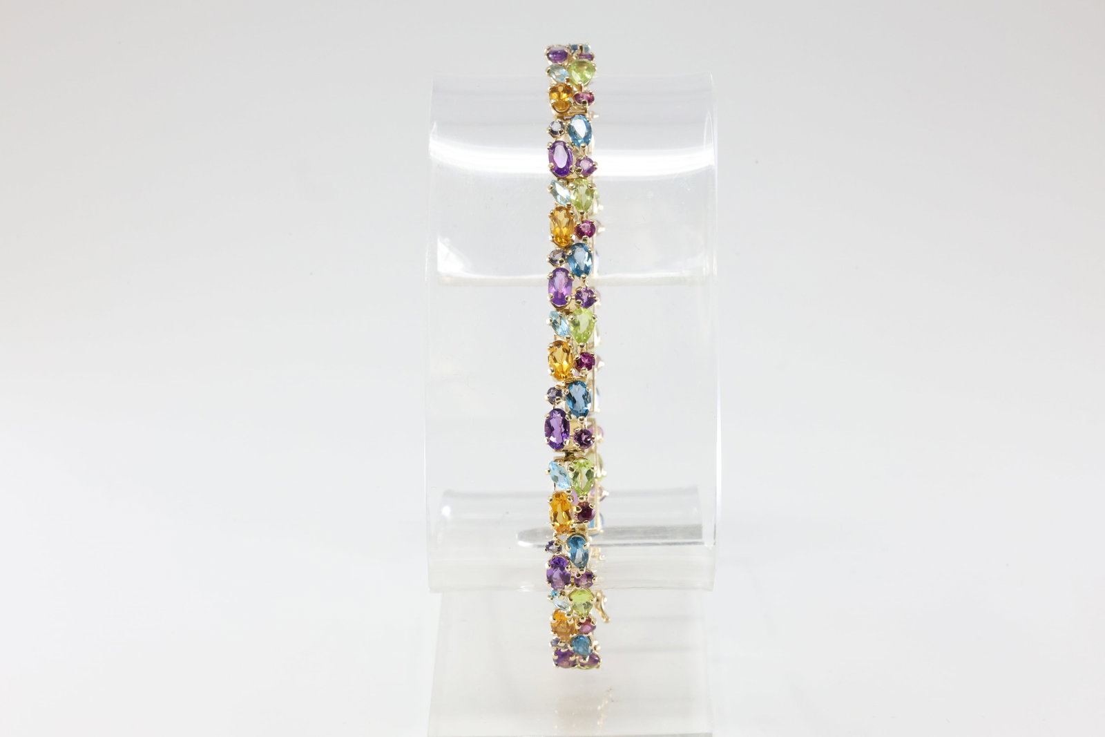 Multi-Color Gemstone Bracelet 14Kt.: 14Kt Yellow Gold Multi-Color Gemstone Bracelet. This Elegant Bracelet has Purple Amethyst / Citrine / Aquamarine & Peridot Gemstones. Bracelet length: 8.00" Total weight: 9.56 Grams.