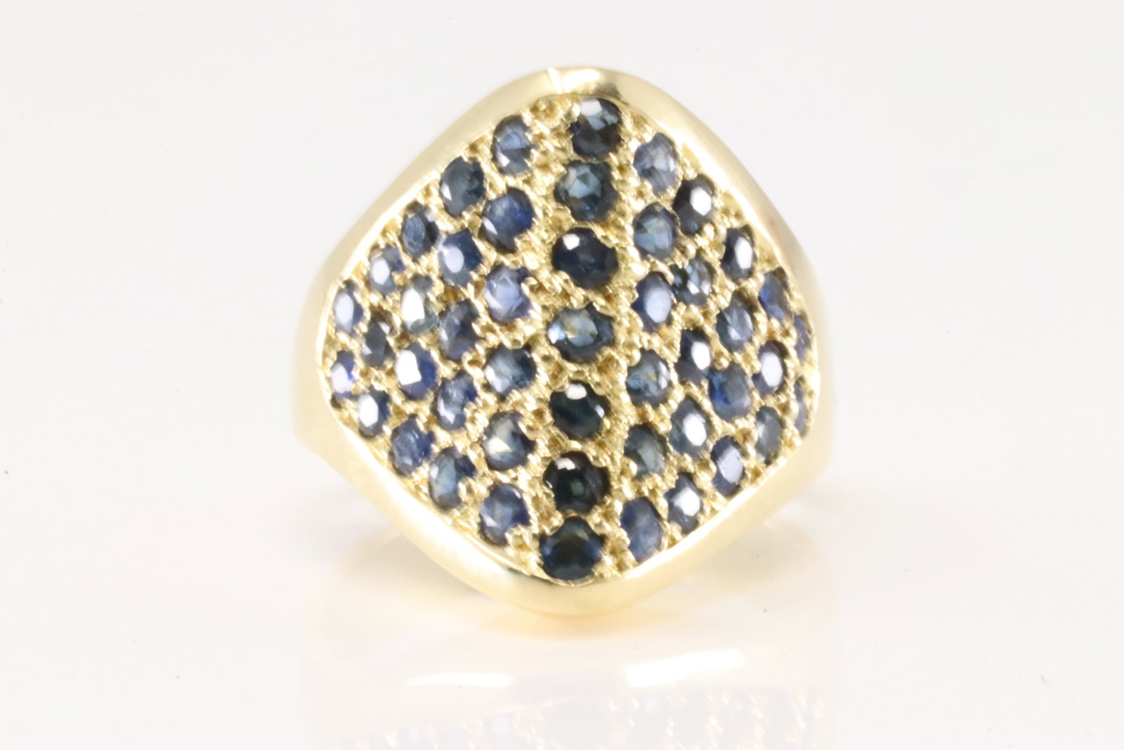 Sapphire Ring 18Kt.: 18Kt Yellow Gold Sapphire Ring. This ring has triangle design with 47 round blue sapphire's. sapphire's weight approx: 1.50ctw. Ring size: 5.00. Total weight: 7.40 Grams.