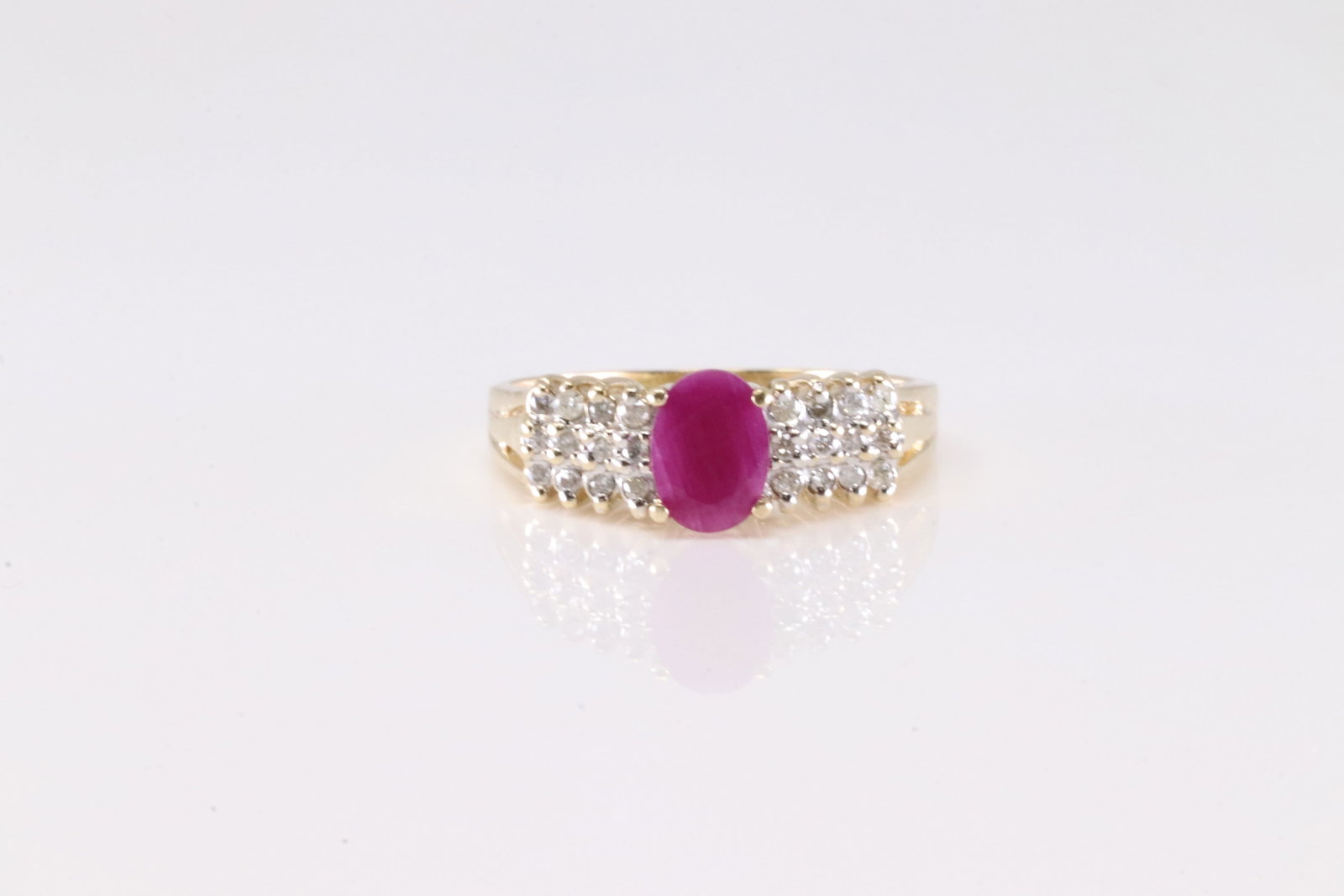 Ruby & Diamond Ring 14Kt.: Ladies 14Kt Yellow Gold Ruby & Diamond Ring. This Elegant Ring has Pink Ruby with Sparkling Diamonds.Ring size: 7.75. Total weight: 3.62 Grams.