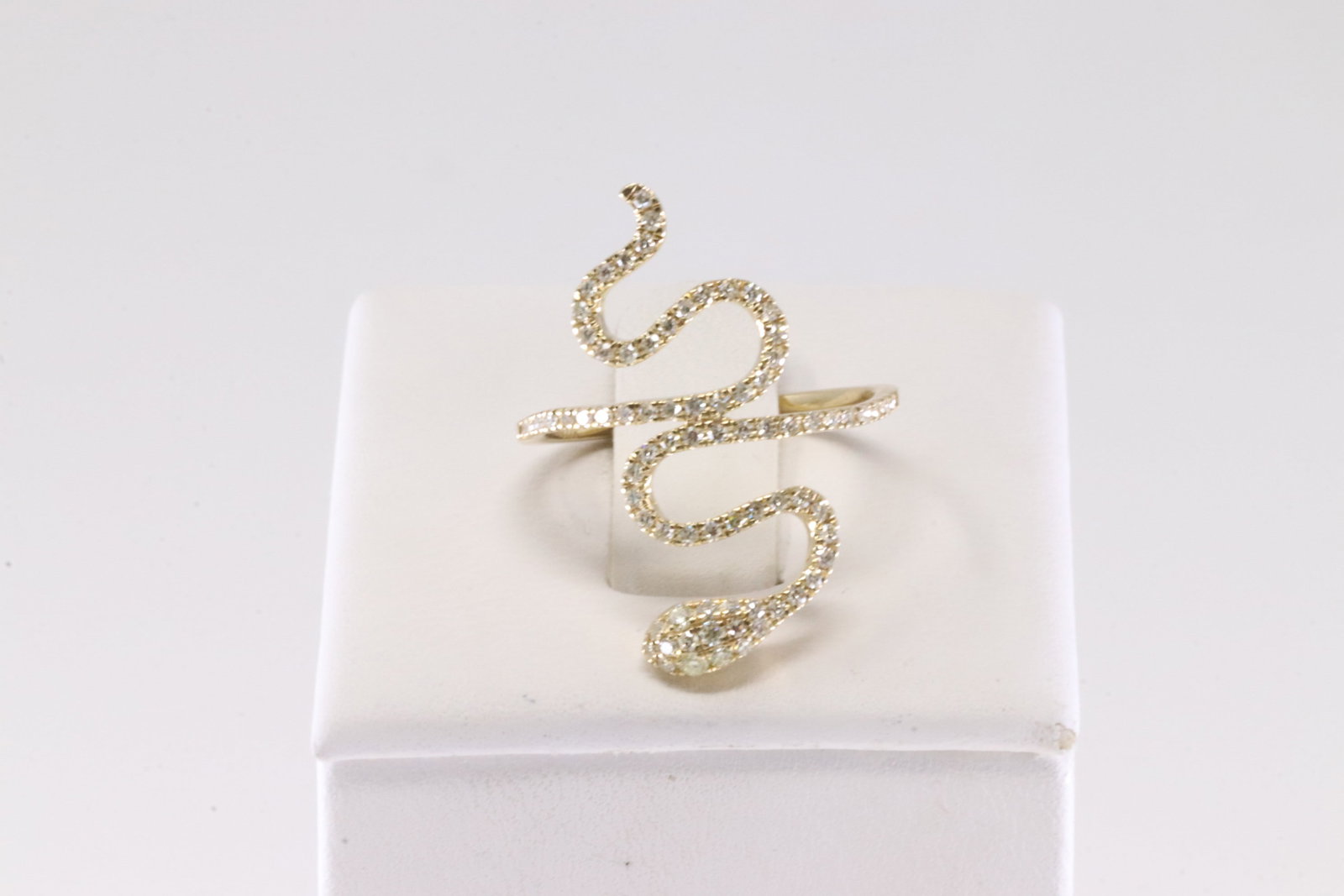 Diamond Ring 10Kt.: Ladies 10Kt Yellow Gold Diamond Ring. This Ring has Curve Serpent Design with Sparkling Diamonds. Diamonds weight: 0.50ctw. Ring size: 6.75.