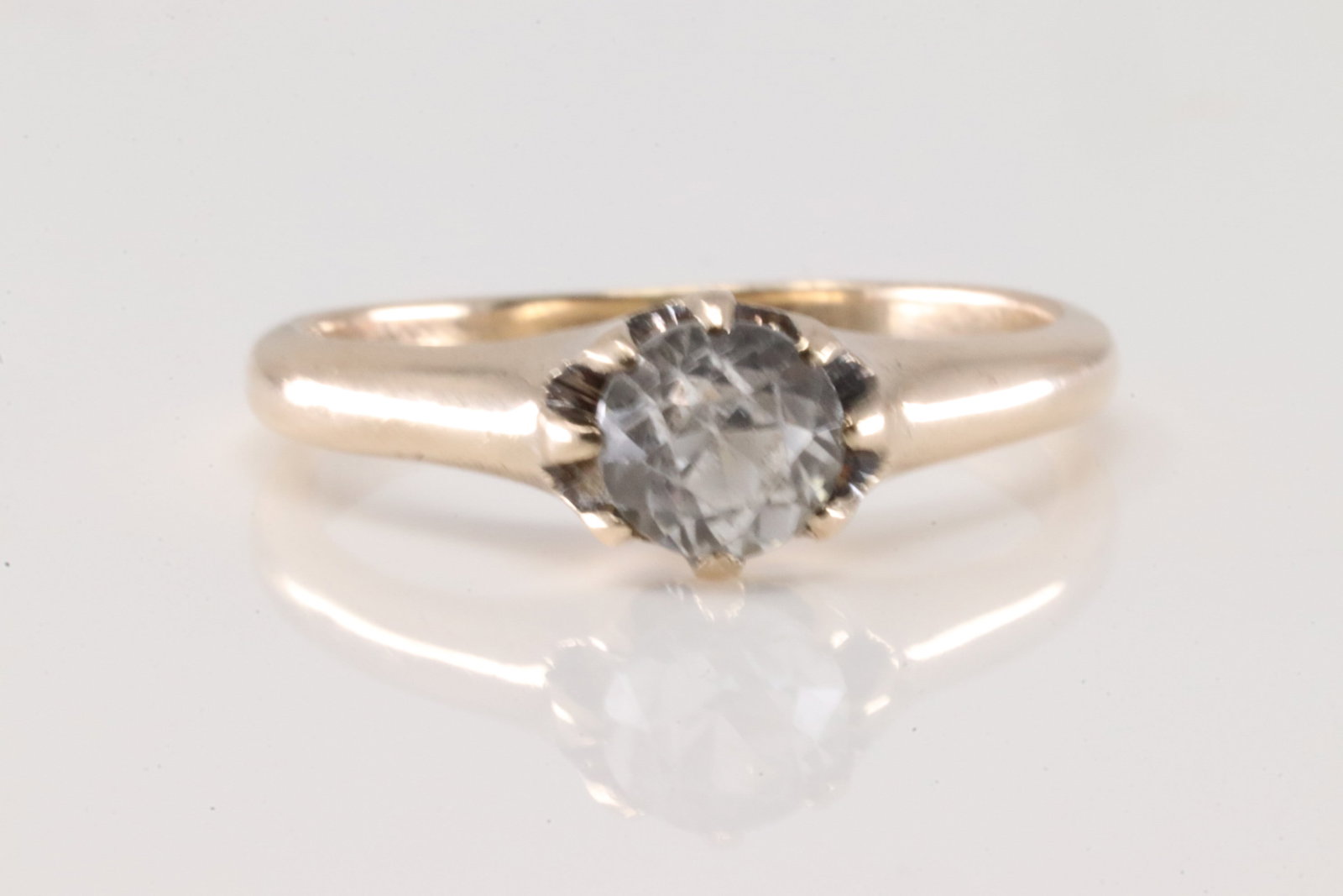 Promise Sapphire Ring 14Kt.: Ladies 14Kt Yellow Gold Promise Sapphire Ring. This beautiful ring has one solitaire brilliant round white sapphire stone set on the center. Ring size: 6.50. Total weight: 2.70 Grams.