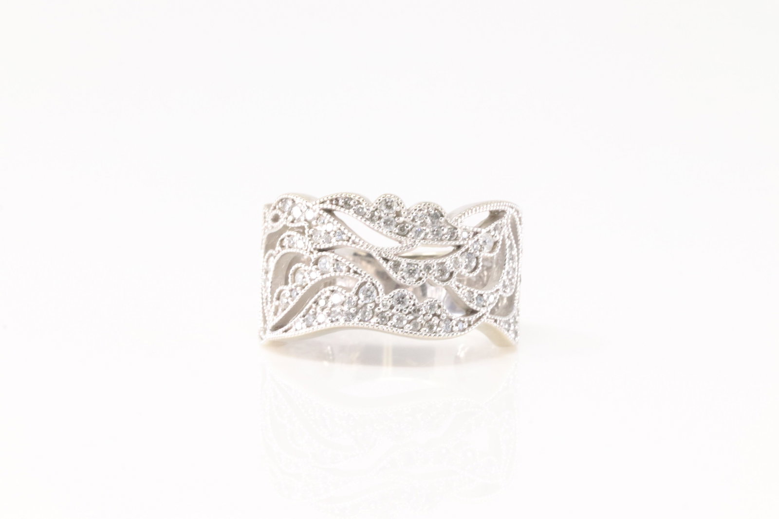 Elegant Diamond Ring 14Kt.: Ladies 14Kt White Gold Diamond Ring. This Elegant Ring has approx 80 Sparkling Diamonds. Diamonds weight approx: 0.90 ctw Ring size: 6.50. Total weight: 7.20 Grams.