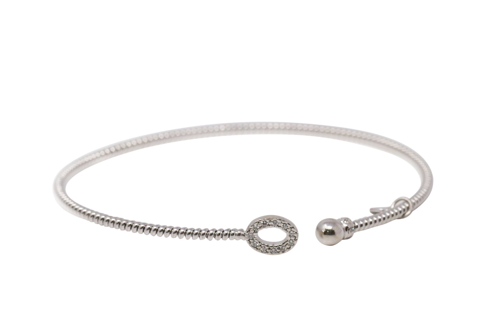 14Kt White Gold Diamond Bangle Bracelet.: 14Kt White Gold Diamond Bracelet. Bracelet has round Diamonds. Diamonds weight: 0.20ctw. Total weight: 5.74 Grams. LD-93JFN