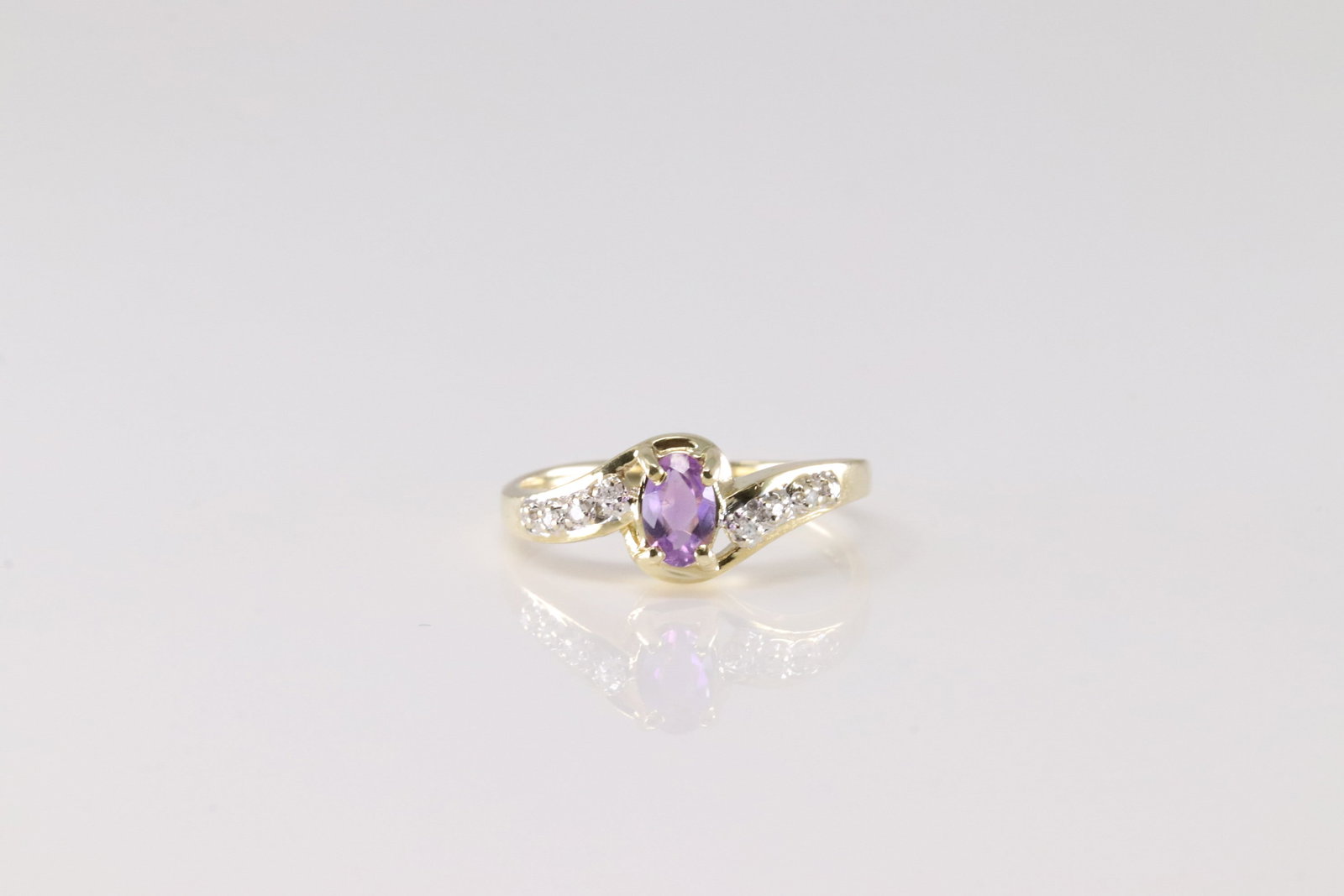 Amethyst & Diamond Ring 14Kt.: Ladies 14Kt Yellow Gold Amethyst & Diamond Ring. This Charming Ring has Purple Amethyst with Sparkling Diamonds. Ring size: 6.50. Total weight: 2.50 Grams.