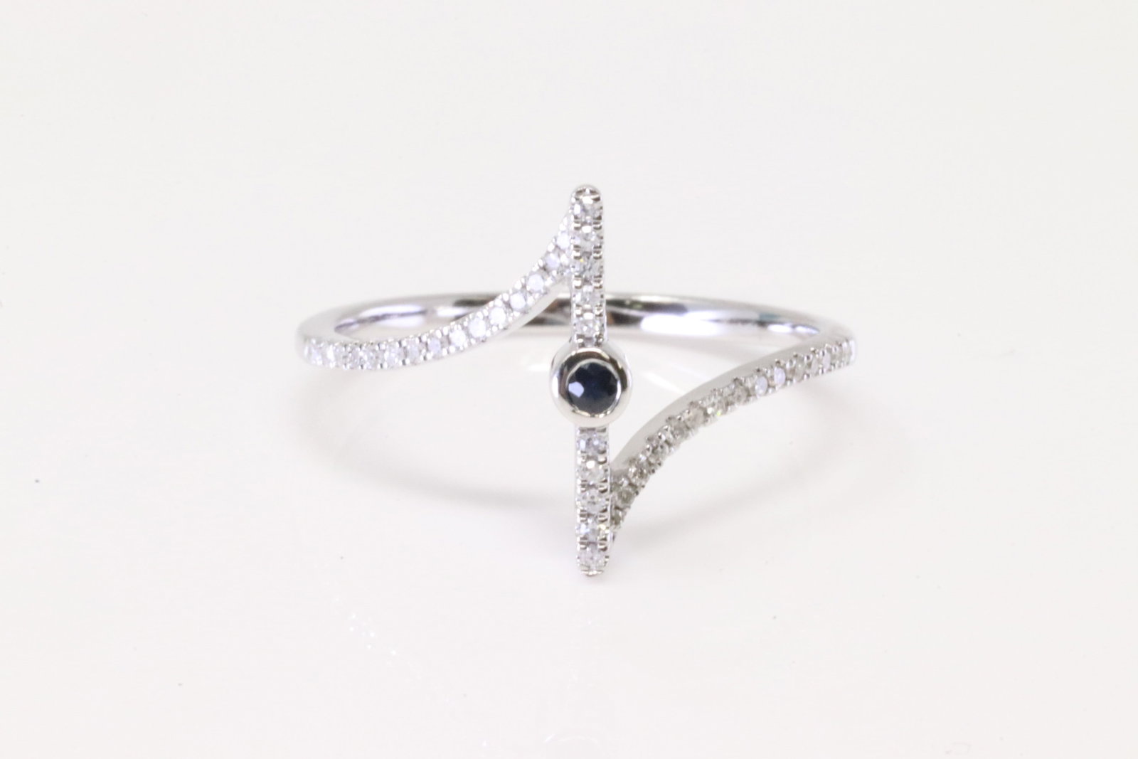 Sapphire & Diamond Ring 10Kt.: Ladies 10Kt White Gold Sapphire & Diamond Ring. Ring has one Sapphire in the center with roun Diamonds. Diamonds weight: 0.15ctw. Ring size: 7.25.