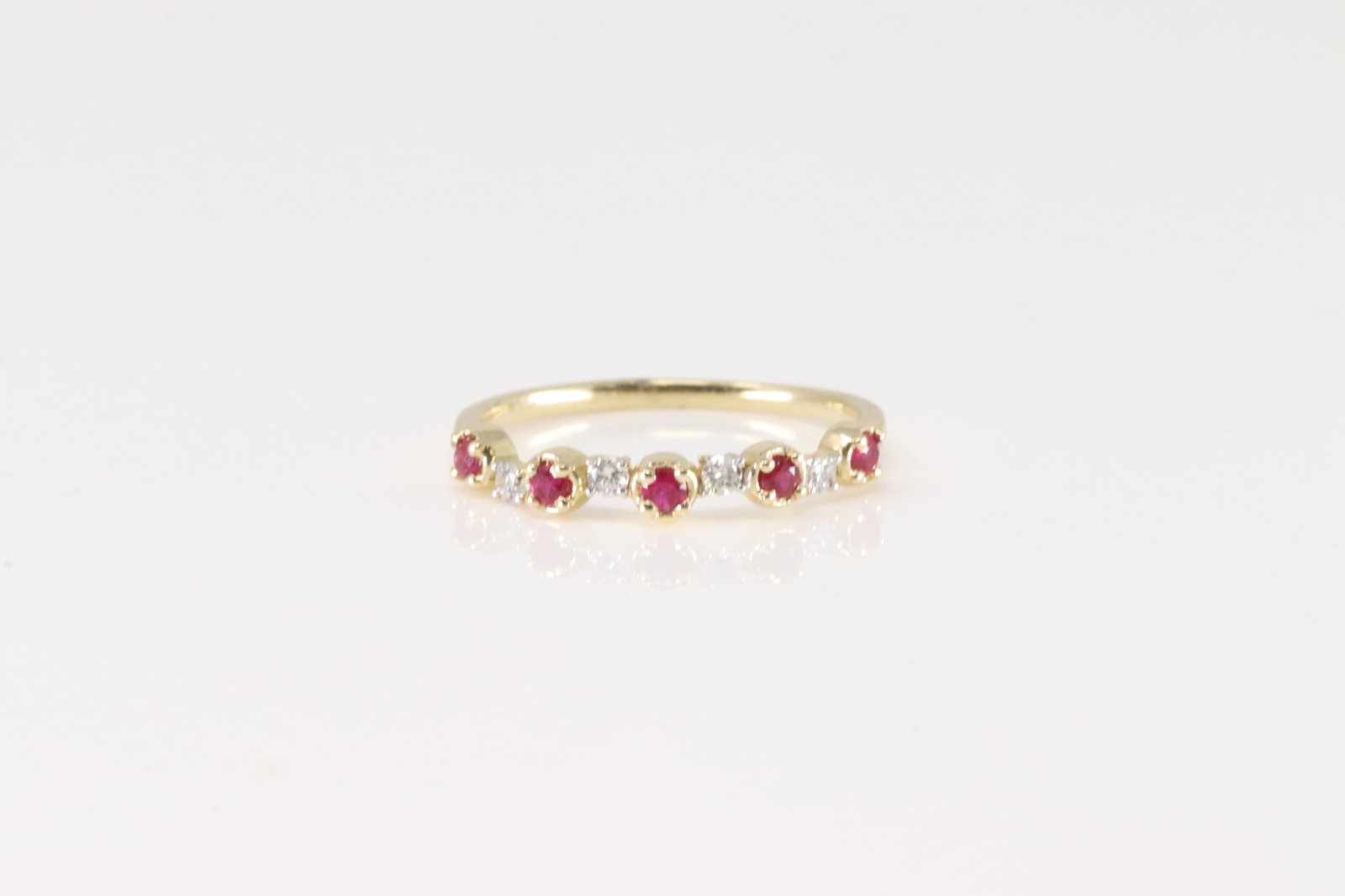 Ruby & Diamond Ring 14Kt.: Ladies 14Kt Yellow Gold Ruby & Diamond Ring. This Ring has 5 Rubies with 4 Sparkling Diamonds. Rubies weight: 0.19ctw. Diamonds weight: 0.10ctw. Ring size: 6.50.