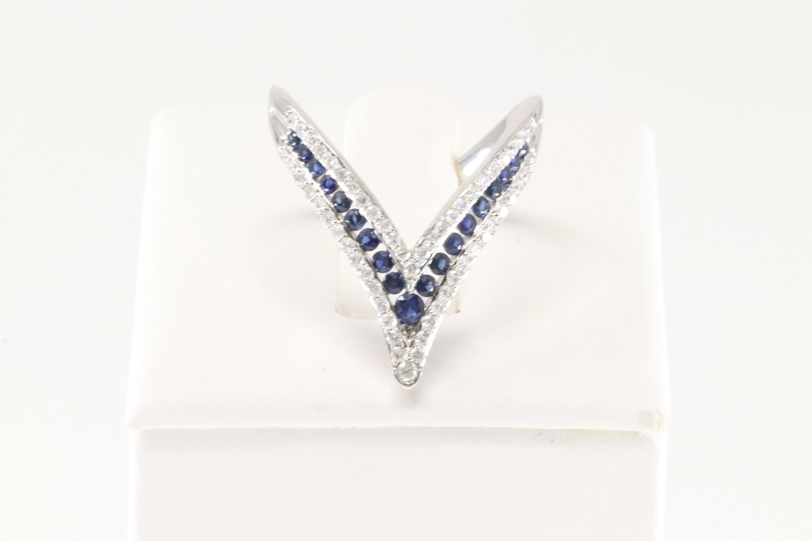 Sapphire & Diamond Ring 14Kt.: Ladies 14Kt White Gold Sapphire & Diamond Ring. This Elegant Ring has 56 Round Sparkling Diamonds & 19 Blue Sapphire Gemstones. Diamond Weight: 0.37ct. Sapphire Weight: 0.38ct. Ring Size: 6.50. Total 