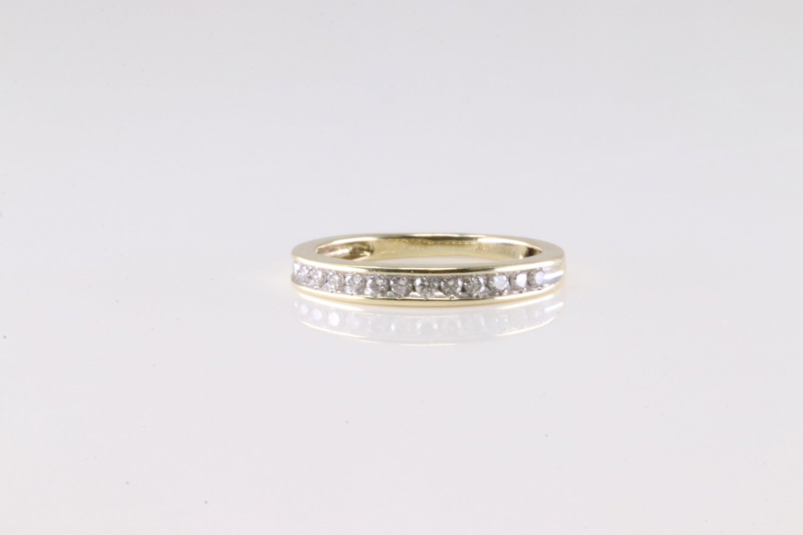 Dimaond Ring 10Kt.: 10Kt Yellow Gold Diamond Ring. This Band Ring has 13 Sparkling Diamonds. Diamonds weight approx: Ring size: 3.75.