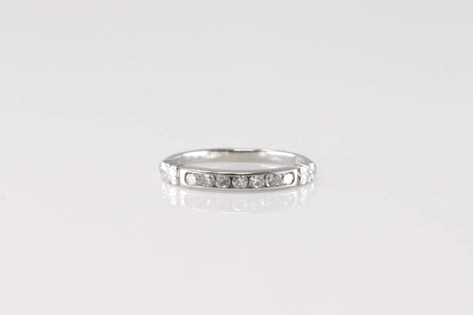 Diamond Ring 18Kt.: Ladies 18Kt White Gold Diamond Ring. This Charming Ring has 7 Sparkling Diamonds. Ring size: 5.00.