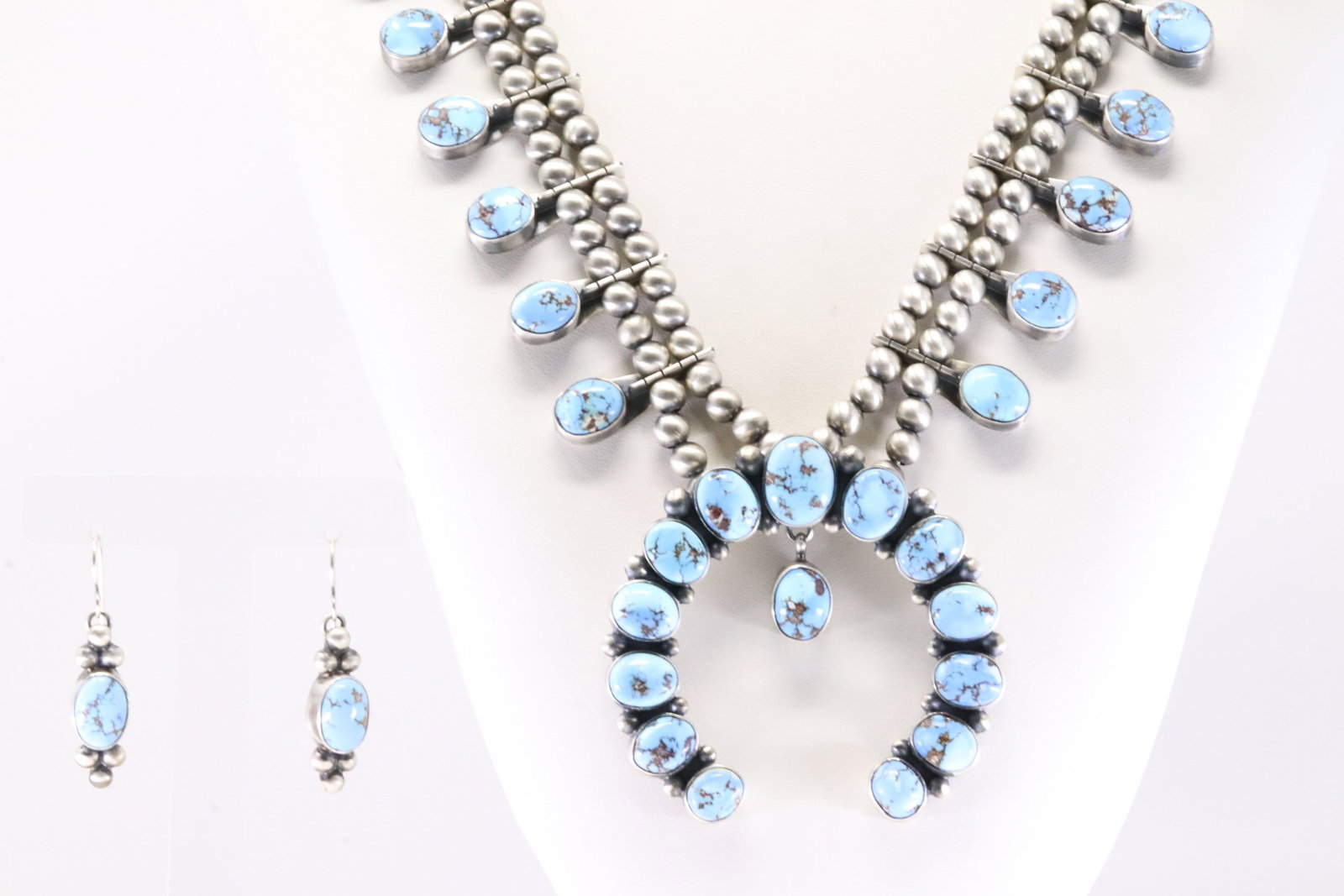 Native America Navajo Sterling Silver Golden Hill Turquoise Squash Necklace & Earring's Set By: This is a Native America Navajo Sterling Silver Golden Hill Turquoise Squash Necklace & Earring's Set By T.Smith. Necklace length: 30.00" Total weight: 165.35 Grams.