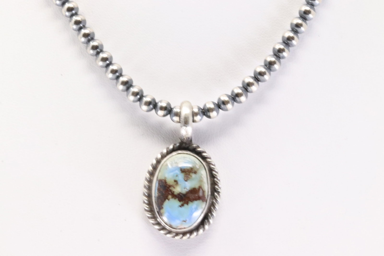 Native America Navajo Sterling Silver Golden Hill Turquoise Pendant By Dixon. With Pearl Beaded: This is a Native America Navajo Sterling Silver Golden Hill Turquoise Pendant By Dixon. With Pearl Beaded Sterling Silver Machine Made Necklace. Necklace length: 14.00"