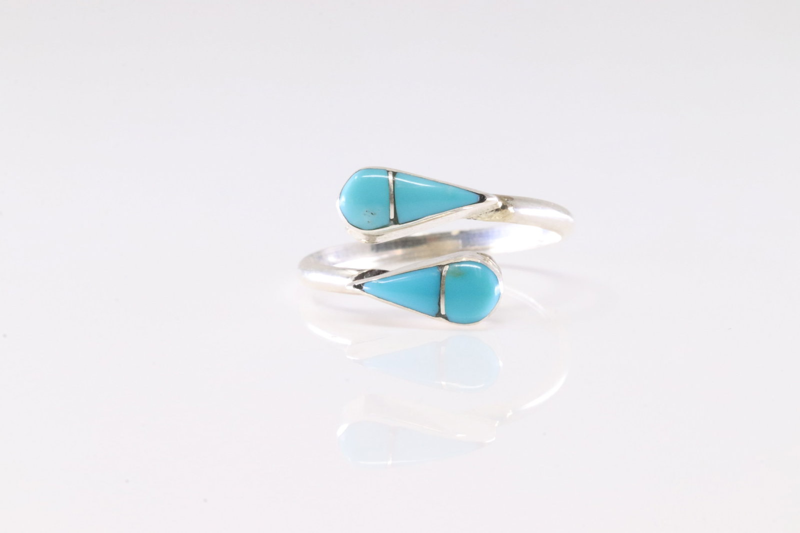 Native America Zuni Sterling Silver Turquoise Inlay Ring By RVN.: This is a Native America Zuni Sterling Silver Turquoise Inlay Ring By RVN. Ring size: 7.25.