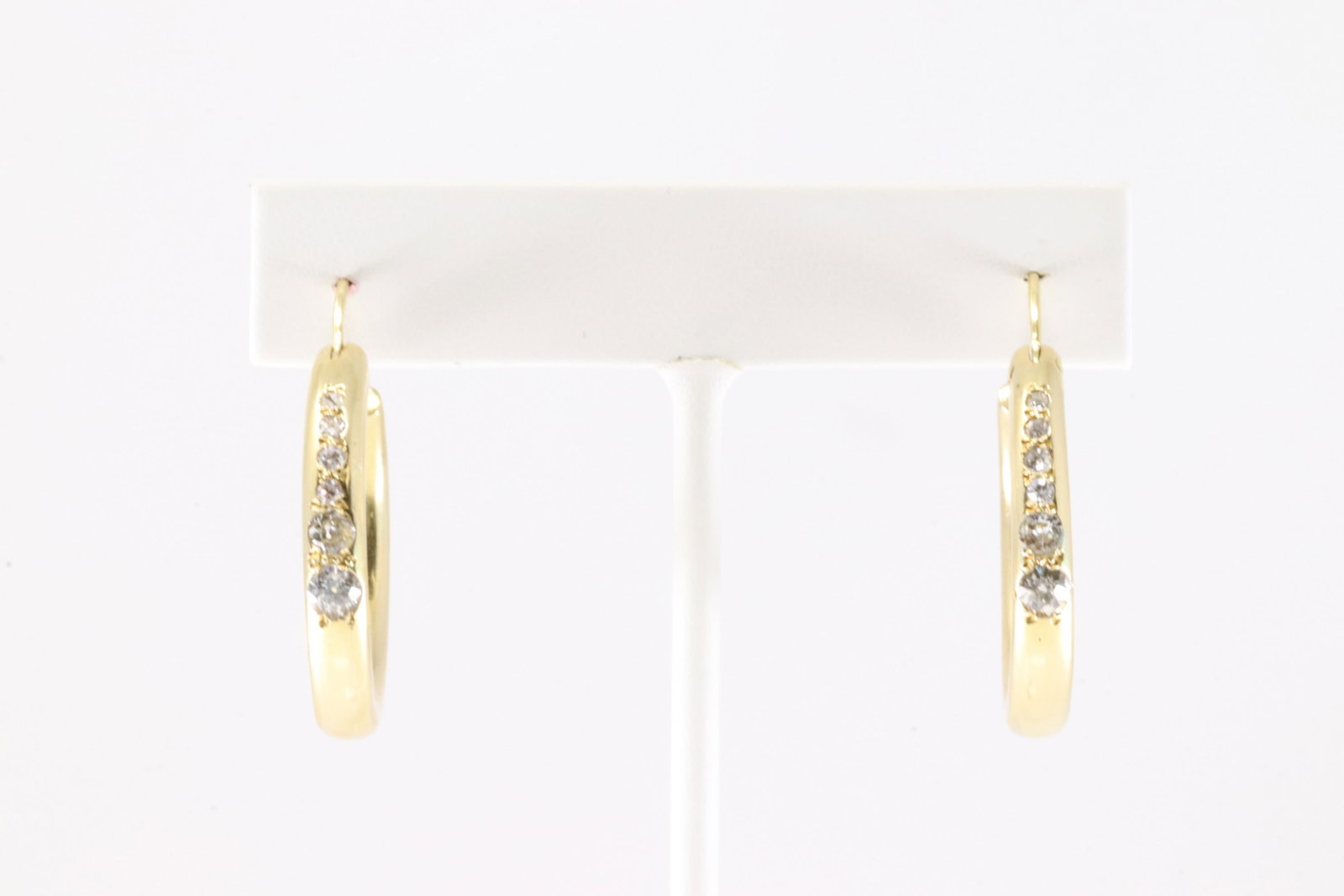 Diamond Hoop Earring 18Kt.: Ladies 18Kt Yellow Gold Diamond Hoop Earring. This Charming Hoop Earring's has A Total 12 Brilliants Diamonds. 6 in each one. Diamonds weight approx: .80 ctw Total weight: 11.90 Grams.