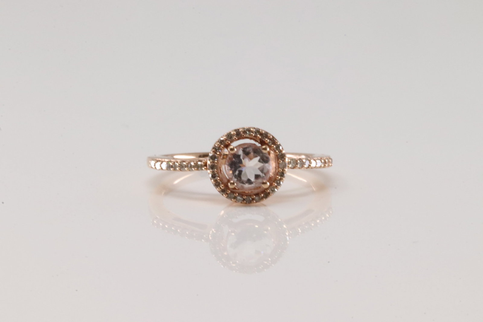 Morganite & Diamond Ring 10Kt.: Ladies 10Kt Rose Gold Morganite & Diamond Ring. This ring has Morganite Gems with Sparkling Diamonds. Diamonds weight: 0.20ctw. Ring size: 7.00. Total weight: 2.40 Grams.