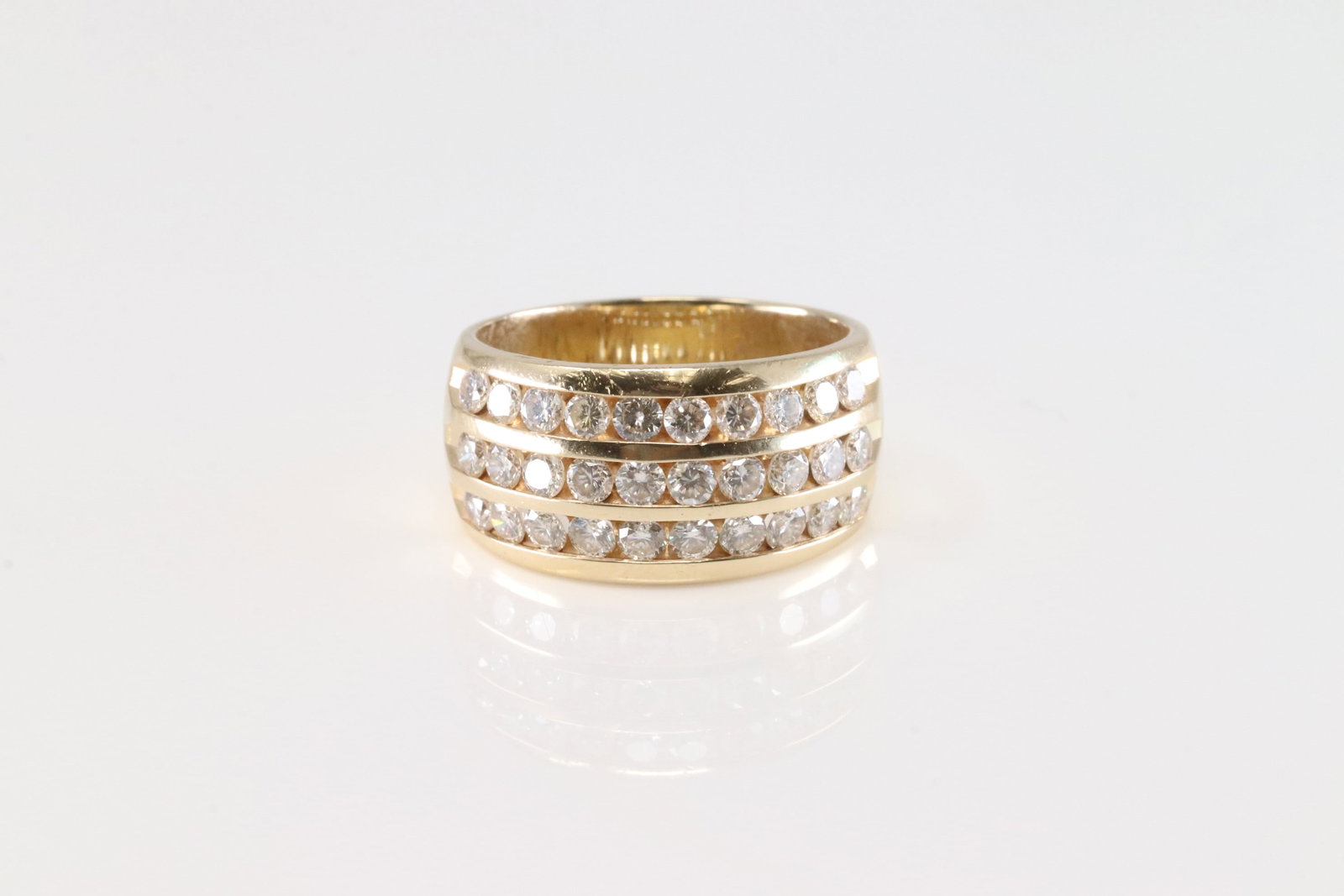 Diamond Ring 14Kt.: Men 14Kt Yellow Gold Diamond Ring. This Elegant Ring has approx 60 White and Champagne Sparkling Diamonds. Diamonds Approx weight: 1.50 ctw Ring size: 10.00. Total weight: 5.70 Grams.