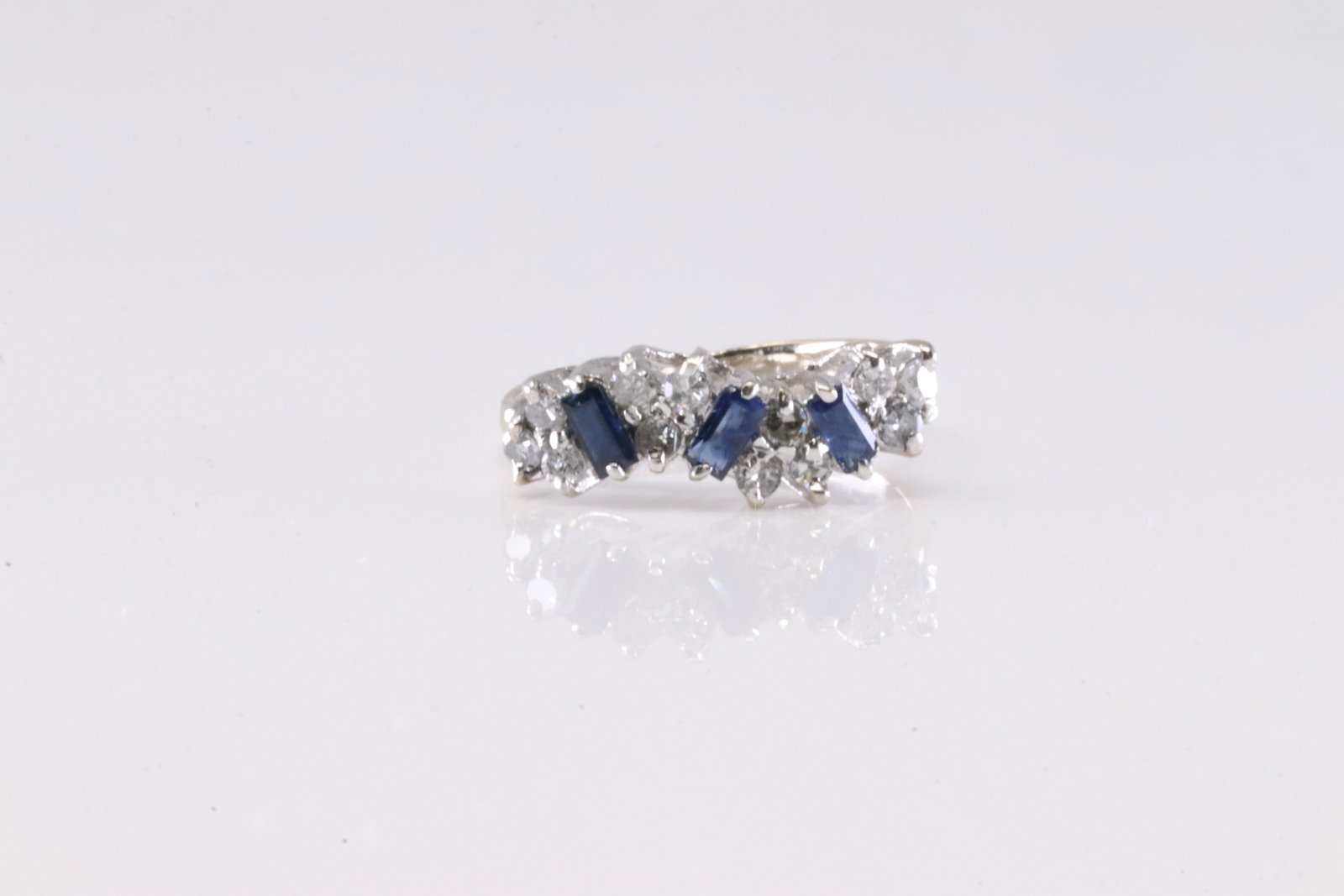 Sapphire & Diamond Ring 18Kt.: Ladies 18Kt White Gold Elegant Sapphire & Diamond. This Elegant Ring has Blue Sapphires & Sparkling Diamonds. Ring size: 5.25. Diamonds weight approx: 0.30ctw. Total weight: 2.74 Grams.