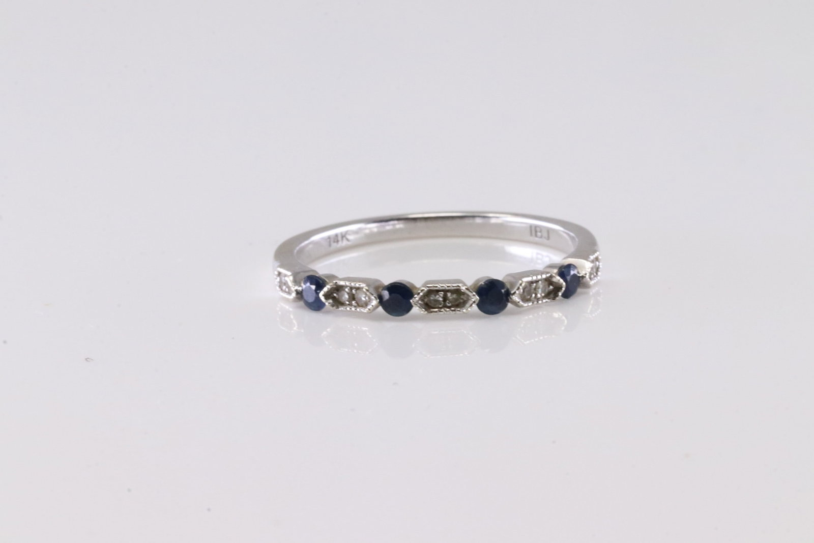 Sapphire & Diamond Ring 14Kt.: Ladies 14Kt White Gold Sapphire & Diamond Ring. This Gorgeous Ring has 4 Blue Sapphire Gemstones With 10 Sparkling Diamonds: Ring Size: 7.00.