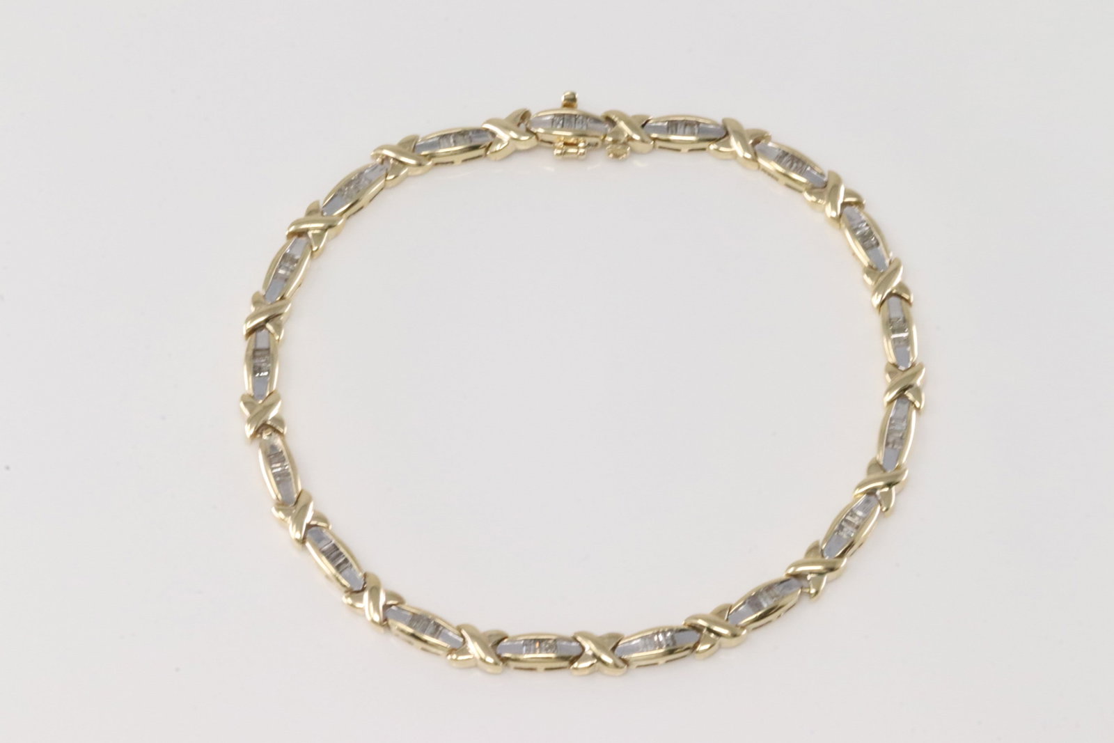 Elegant Diamond Bracelet 14Kt.: 10Kt Yellow Gold Diamond Bracelet. This Elegant Bracelet has 51 Baguette Diamonds. Diamonds weight approx: 1.00 ctw Bracelet length: 9.00. Total weight: 10.20 Grams.
