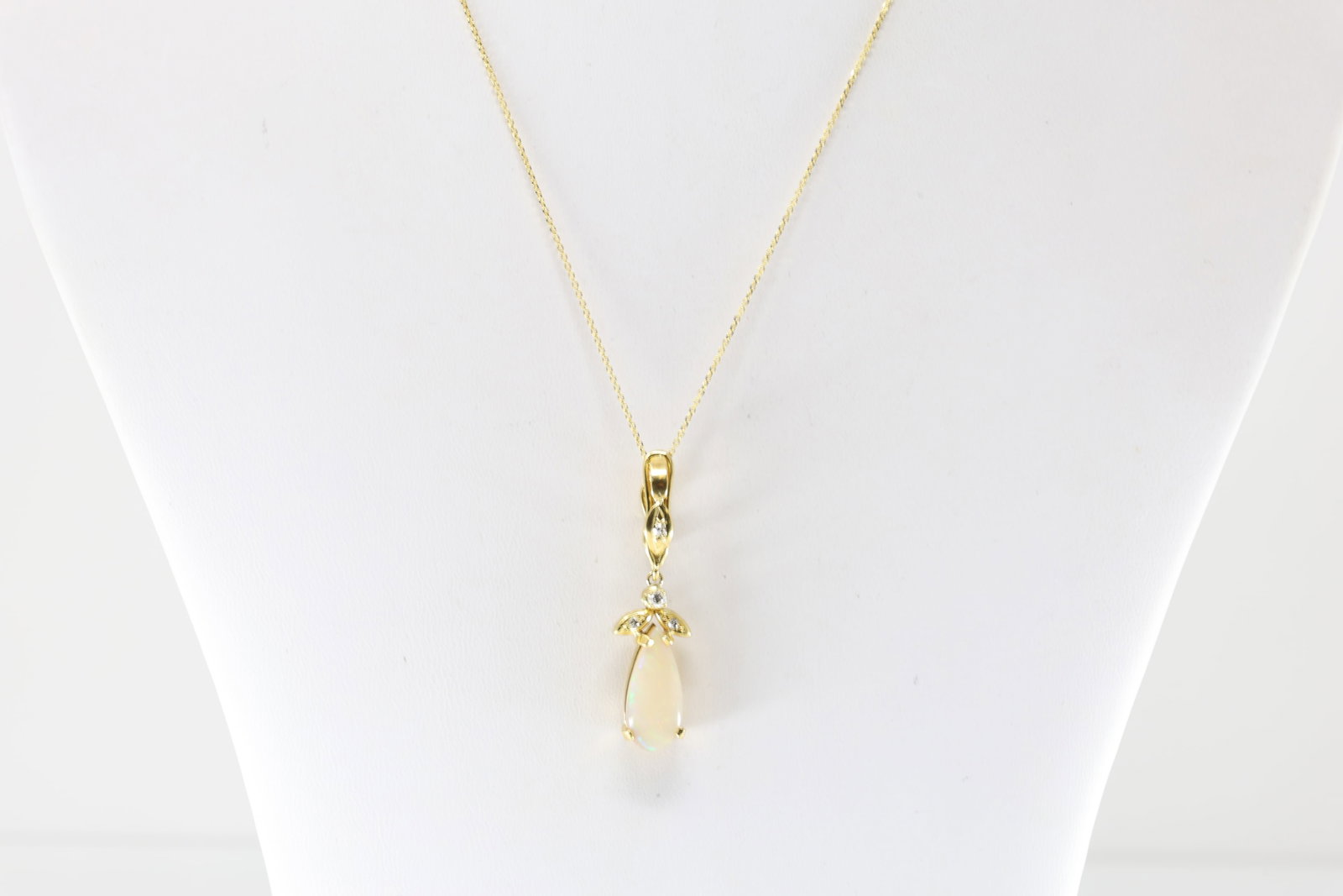 Opal & Diamond Pendant / Necklace 18Kt.: 18Kt Yellow Gold Opal & Diamond Pendant / Necklace. Pendant is a masterpiece of elegance and sophistication with Pear-Shaped Opal & 4 round diamonds,elegantly suspended from a delicate 10K chain. Diam