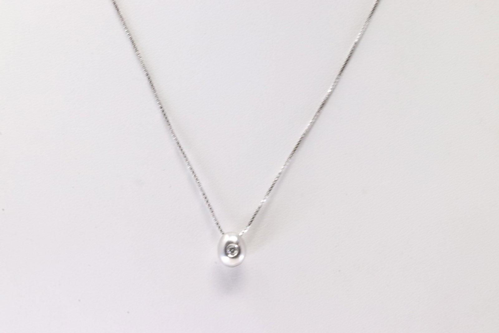 Diamond Pendant & Necklace 18Kt.: 18Kt White Gold Diamond Pendant / Necklace. This Necklace has Pendant with Solitaire Sparkling Diamond. Necklace length: 16.00" Total weight: 3.26 Grams.