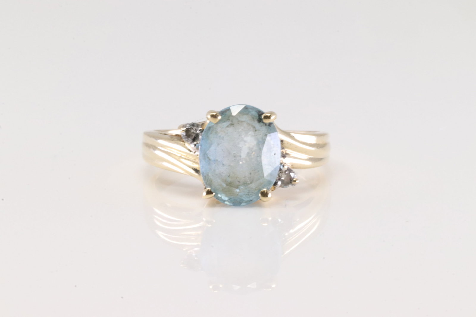 Aquamarine & Diamond Ring 14Kt.: Ladies 14Kt Yellow Gold Aquamarine & Diamond Ring. This Ring has A Gorgeous Aquamarine Gemstone With 2 Round Sparkling Diamonds. Ring Size: 6.00. Total Weight: 4.22 Grams.
