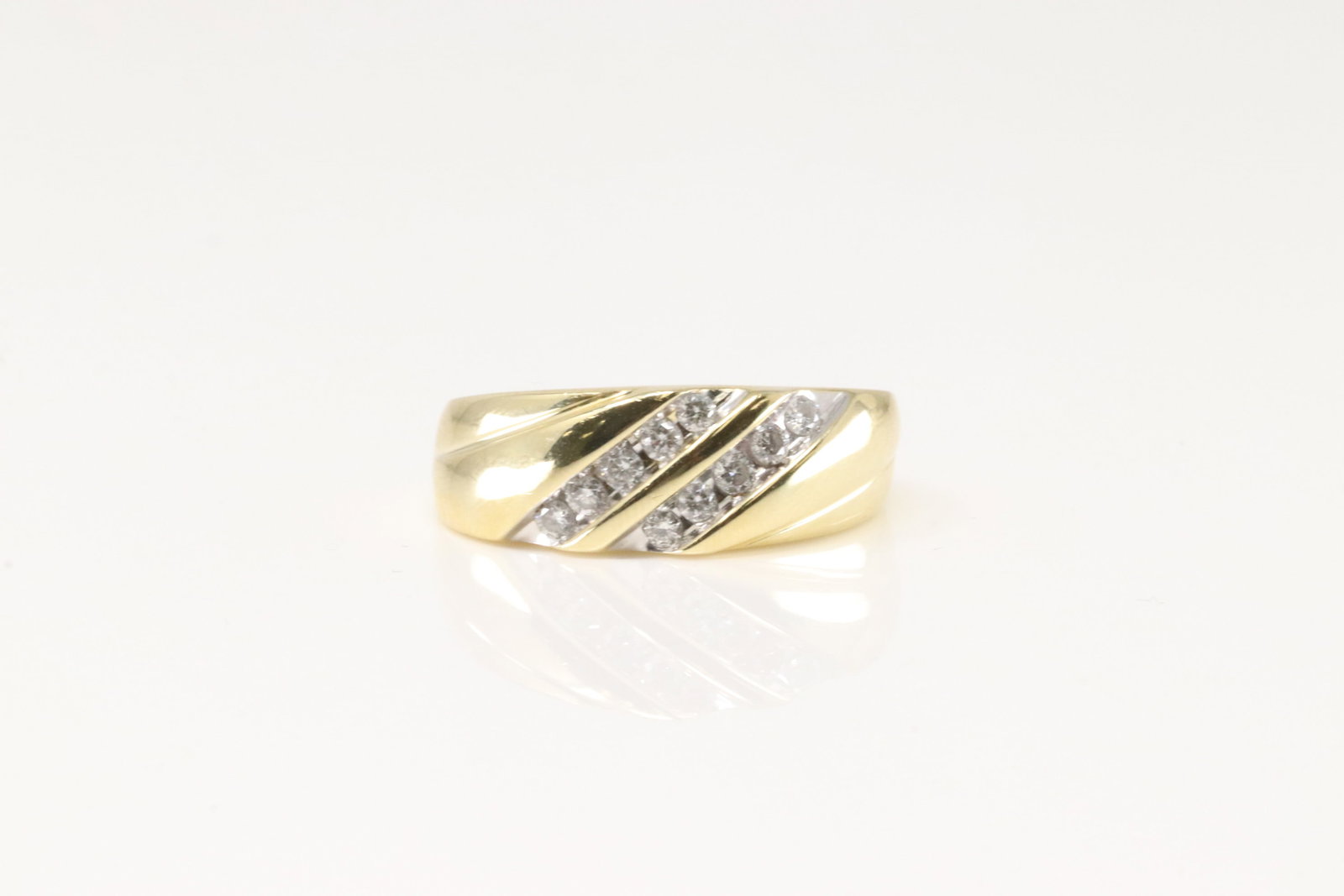 Diamond Ring 14Kt.: Ladies 14Kt Yellow Gold Diamond Ring. This Elegant Ring Has 10 Sparkling Diamonds. Ring Size: 10.00. Total Weight: 7.40 Grams.