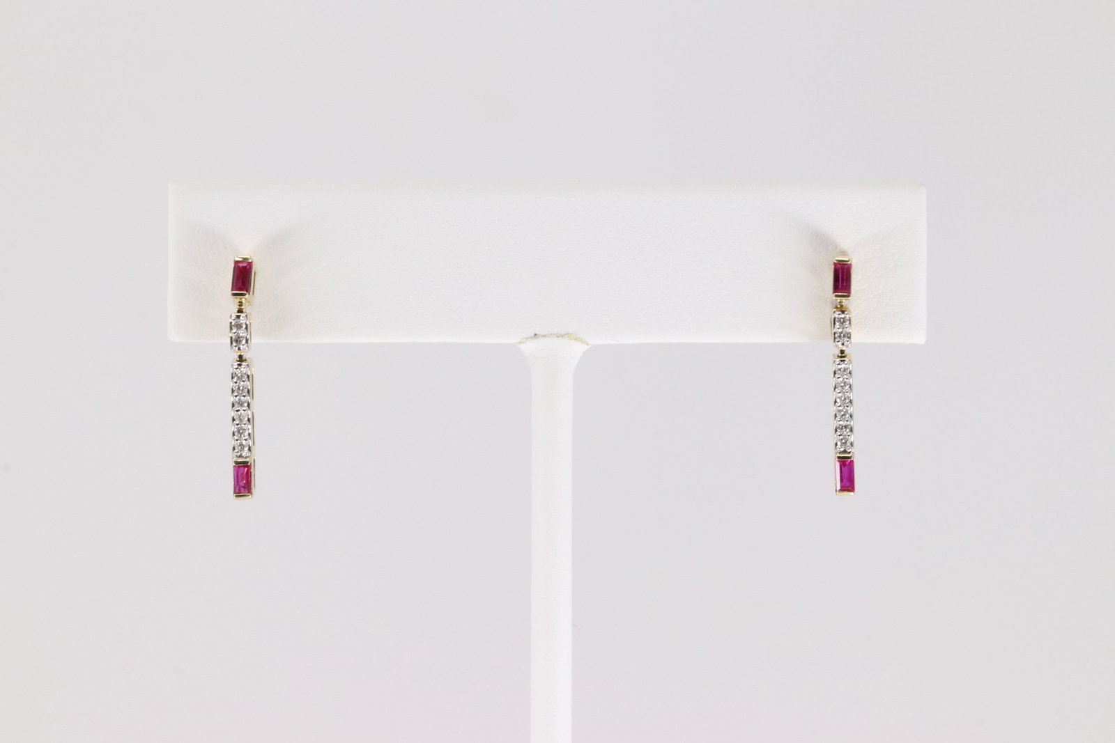 Ruby & Diamond Stud / Dangling Earring 14Kt.: Ladies 14Kt Yellow Gold Ruby & Diamond Stud / Dangling Earring. This Charming Stud / Dangling Earring has 4 Rubies with 18 Sparkling Diamonds. Rubies weight: 0.26ctw. Diamonds weight: 10ctw.