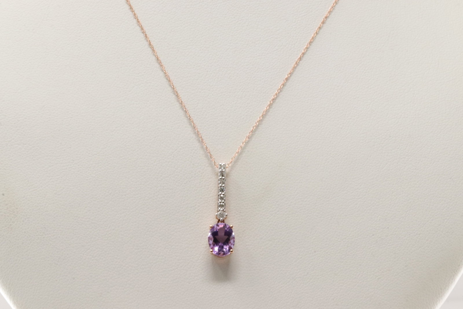 Amethyst & Diamond Pendant / Necklace 14Kt.: Ladies 14Kt Rose Gold Amethyts & Diamond Pendant / Necklace. This Beautiful Pendant has Oval Amethyts with 7 Round Diamons and A Necklace. Diamonds weight: 0.25ctw. Necklace length: 18.00"