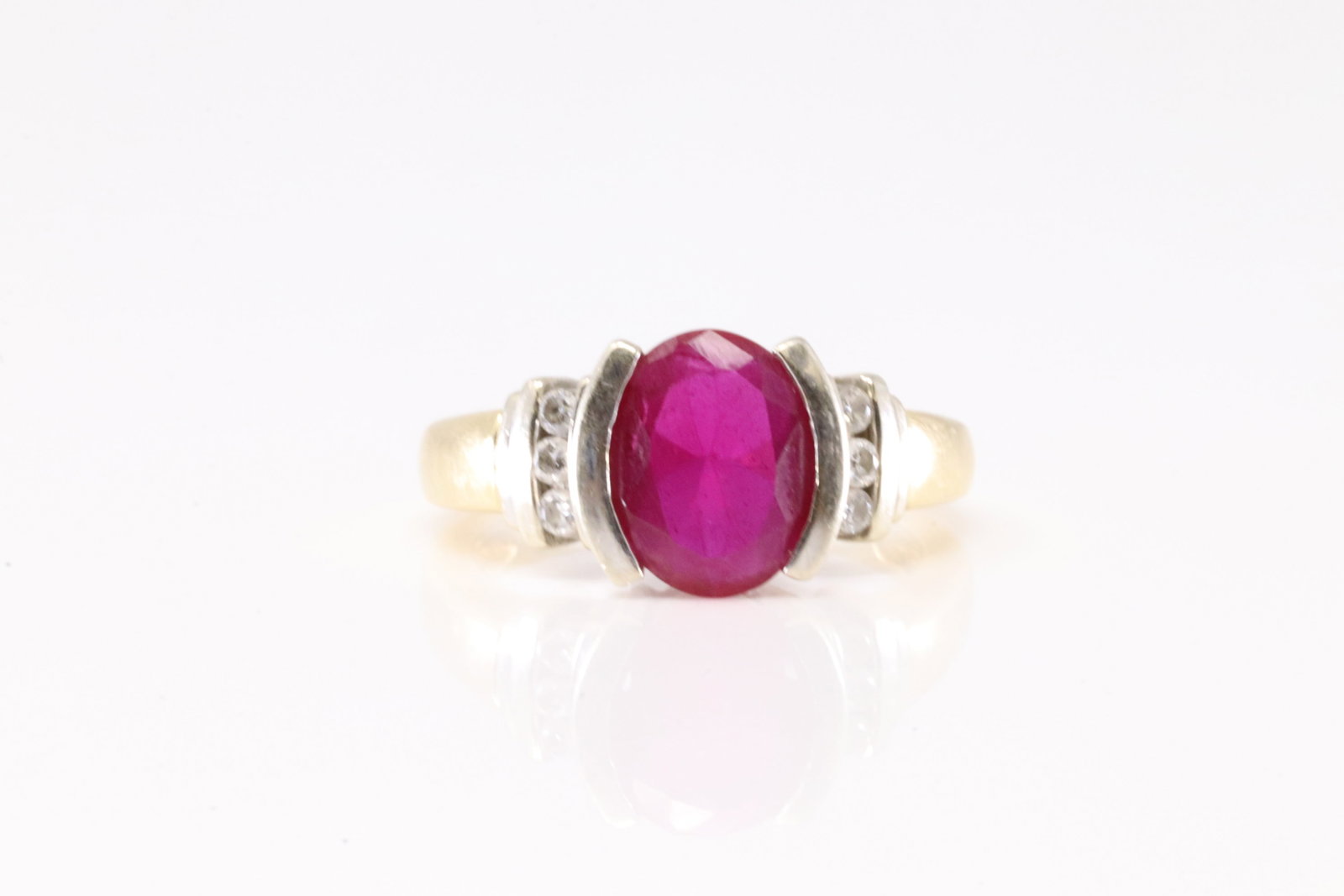 Elegant Ruby & Diamond Ring 14Kt.: 14Kt Yellow Gold Ruby & Diamond Ring. This Elegant Ring has 2 Tone Gold with one Ruby and 6 Sparkling Diamonds. Ring size: 6.50. Total weight: 5.66 Grams.