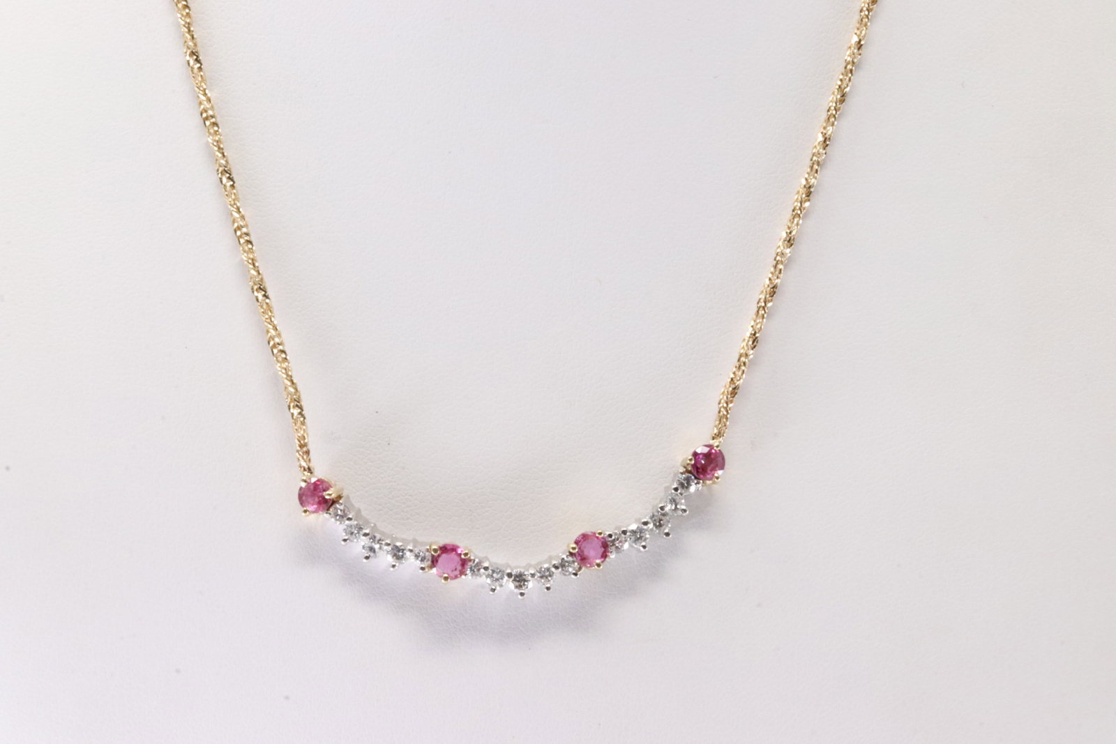 Elegant Ruby & Diamond Necklace 14Kt.: Ladies 14Kt Yellow Gold Ruby & Diamond Necklace. This Elegant Necklace has Charm with 4 Rubies & 15 Brilliants Diamonds. Diamonds weight approx: 0.75ctw. Necklace length: 16.00" Total weight: 8.16 Gra