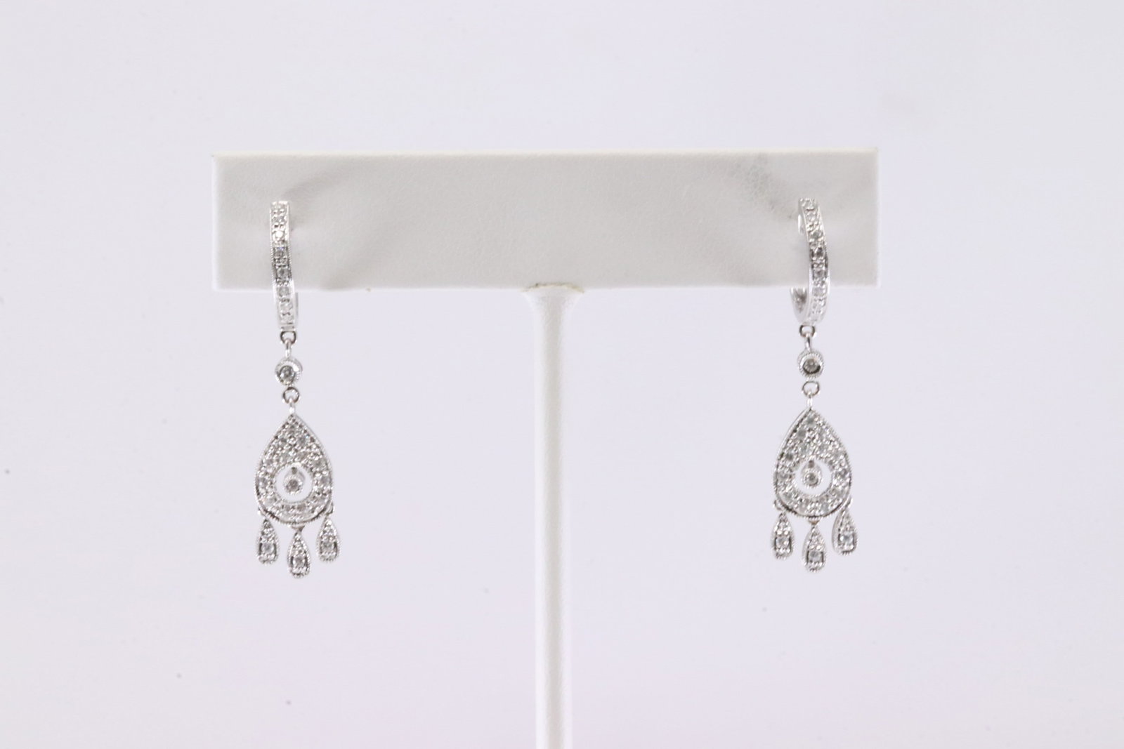 Diamond Teardrop Hoop Earring 18Kt.: Ladies 18Kt White Gold Diamond Teardrop Hoop Earring. This Elegant Hoop Earring's has Teardrop Design with Sparkling Diamonds. Total weight: 4.00 Grams.