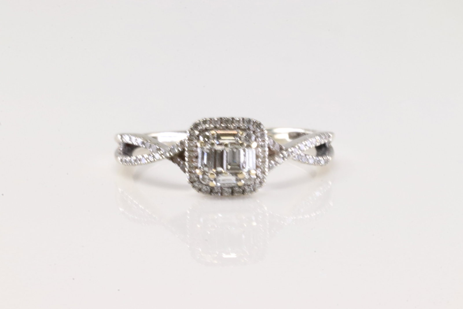 Diamond Ring 14Kt.: Ladies 14Kt White Gold Diamond Ring. This Elegant Ring has 6 Baguette / 65 Round Sparkling Diamonds. Diamond Approx Weight: 1.30 ctw Ring Size: 7.00. Total Weight: 2.14 Grams.