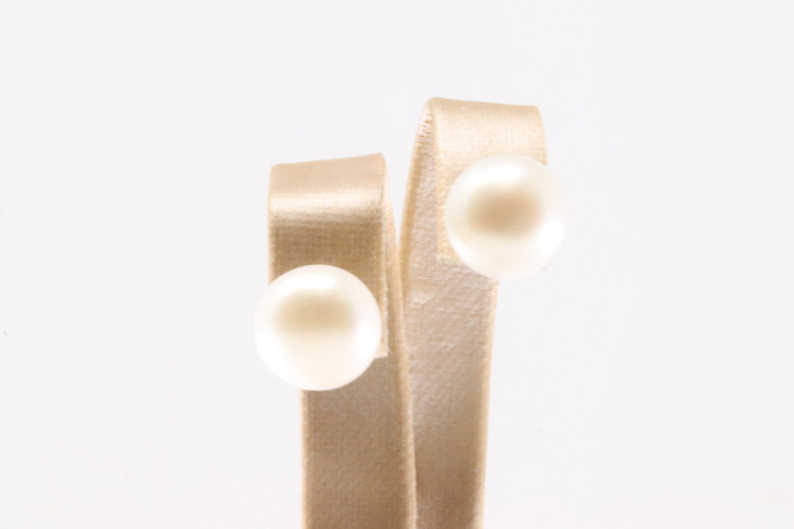 14KT Gold Pearl Post Earrings: Elegantly simple, these classic pearl earrings offer a timeless addition to any jewelry collection. Their lustrous sheen adds a touch of sophistication and grace, perfect for both everyday wear and