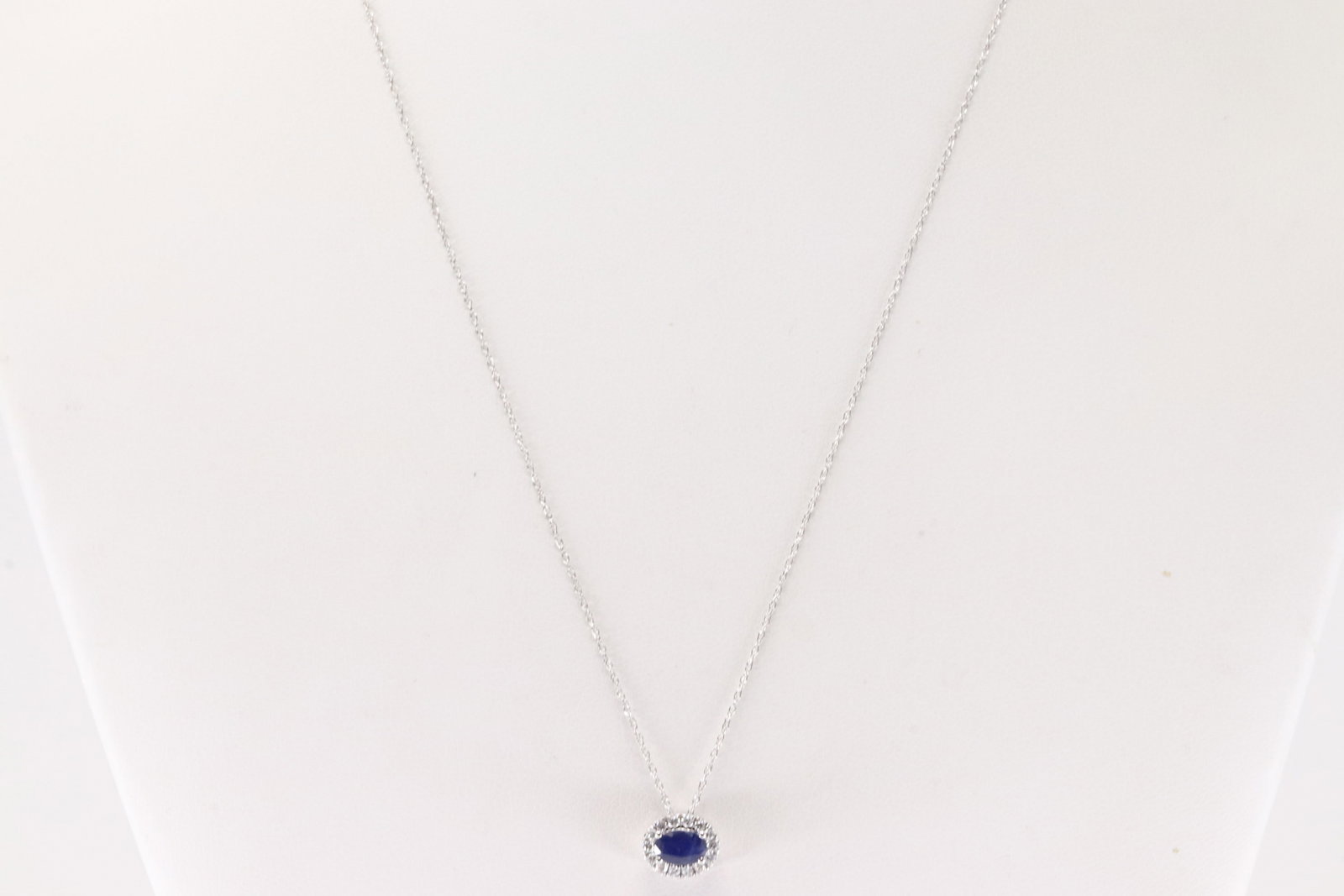 Sapphire & Diamond Pendant / Necklace 14Kt.: Ladies 14Kt White Gold Sapphire & Diamond Pendant / Necklace. This Charming Pendant has Oval Sapphire with 14 Round Diamonds and A Necklace. Sapphire weight: 0.55ct. Diamonds weight: 0.15ctw.
