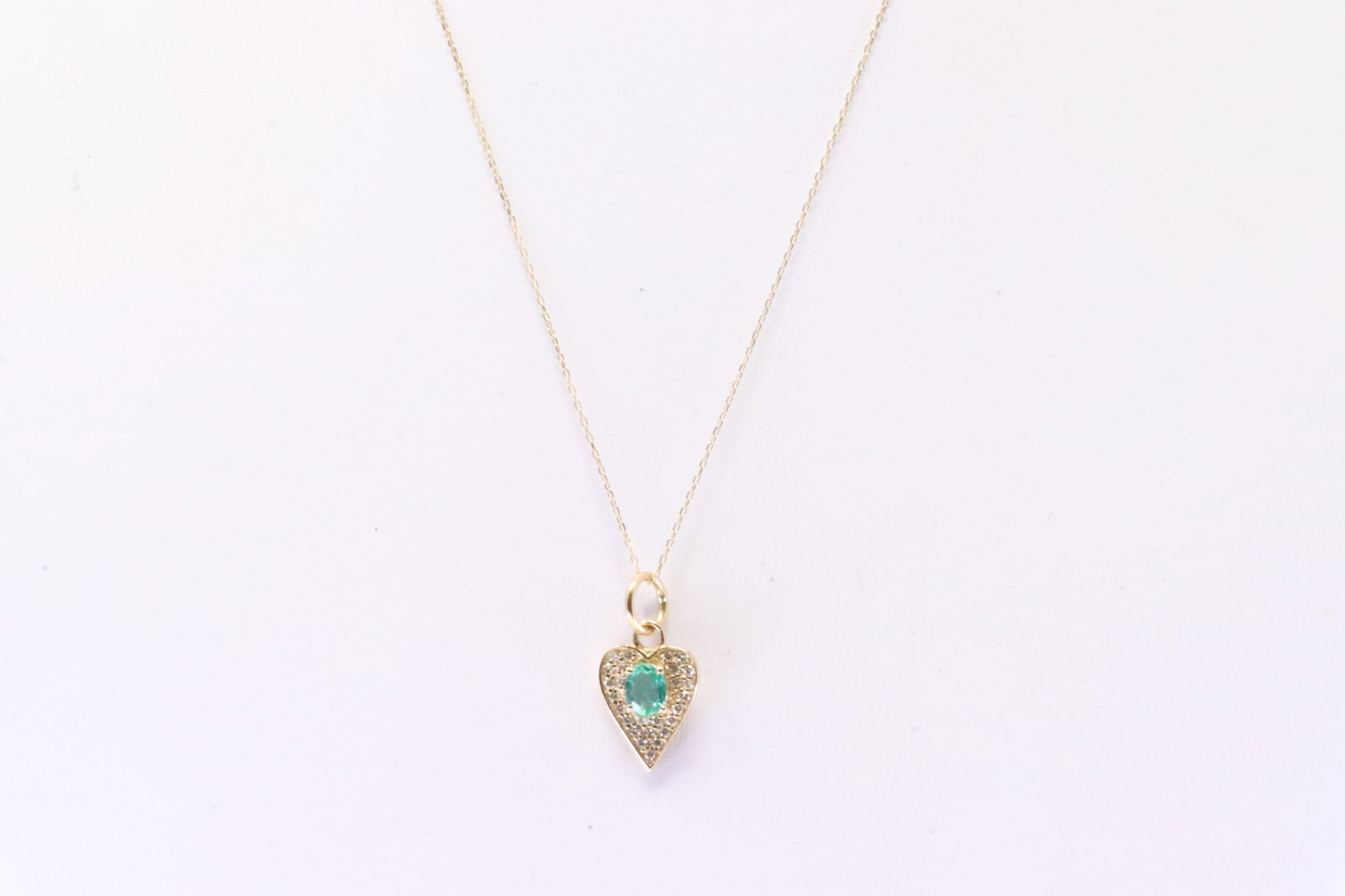 Emerald & Diamond Heart Pendant & Necklace 14Kt.: Ladies 14Kt Yellow Gold Emerald & Diamond Heart Pendant & Necklace. Necklace has Heart Design with Emerald / round Diamonds & A Necklace. Diamonds weight 0.30ctw. Necklace length: 16.00"
