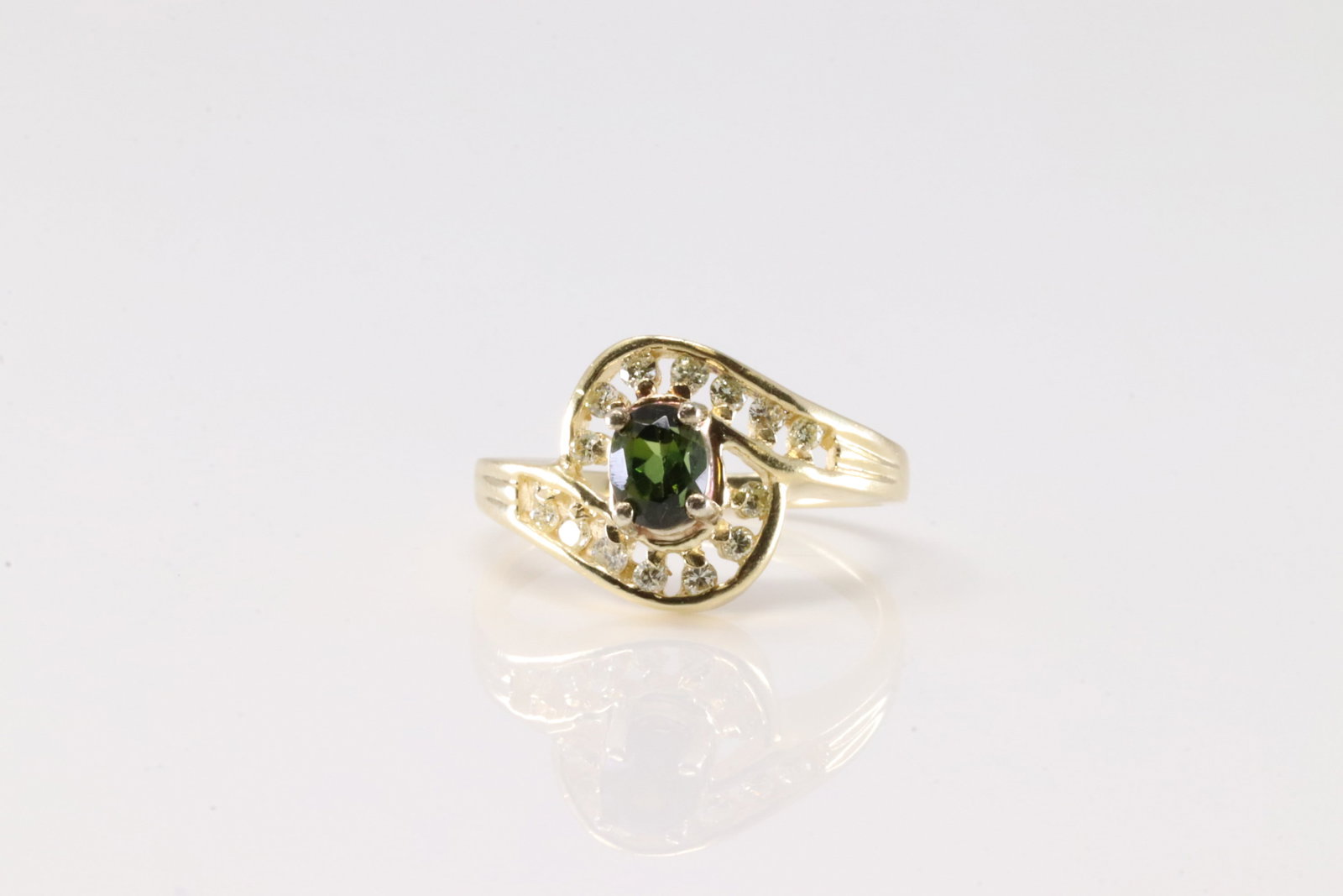 Green Tourmaline & Diamond Ring 14Kt.: Ladies 14Kt Yellow Gold Green Tourmaline & Diamond Ring. This Charming Ring has green Tourmaline Gemstoen with 14 Sparkling round Diamonds. Ring size: 5.50. Total weight: 3.00 Grams.