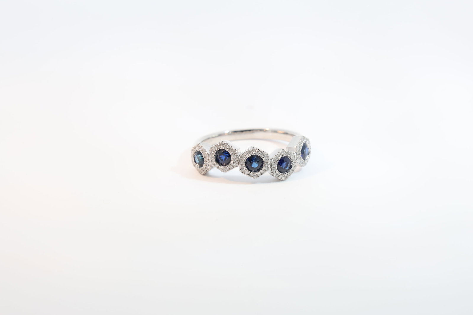 Sapphire & Diamond Ring 14Kt.: Ladies 14Kt White Gold Sapphire & Diamond Ring. Ring has 5 round Sapphire's with 90 round Diamonds. Dimaonds weight: 0.15ct. Sapphire's weight: 0.61ct. Ring size: 6.50. Total weight: 3.20 Grams.