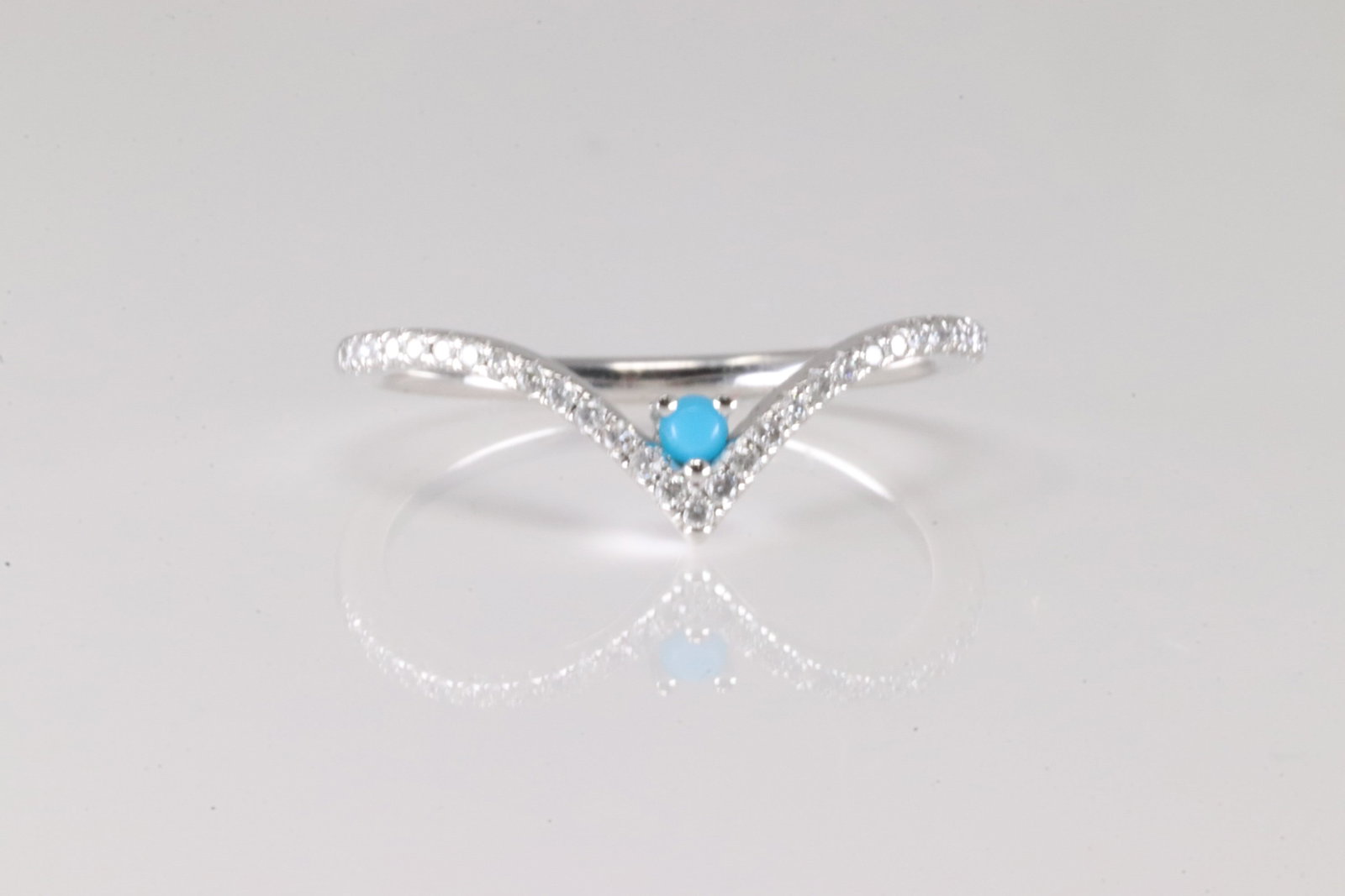 Turquoise & Diamond Ring 14Kt.: Ladies 14Kt White Gold Turquoise & Diamond Ring. This ring has one tuquoise with 30 round diamonds. Diamonds weight approx: 0.14ctw. Ring size: 6.50.