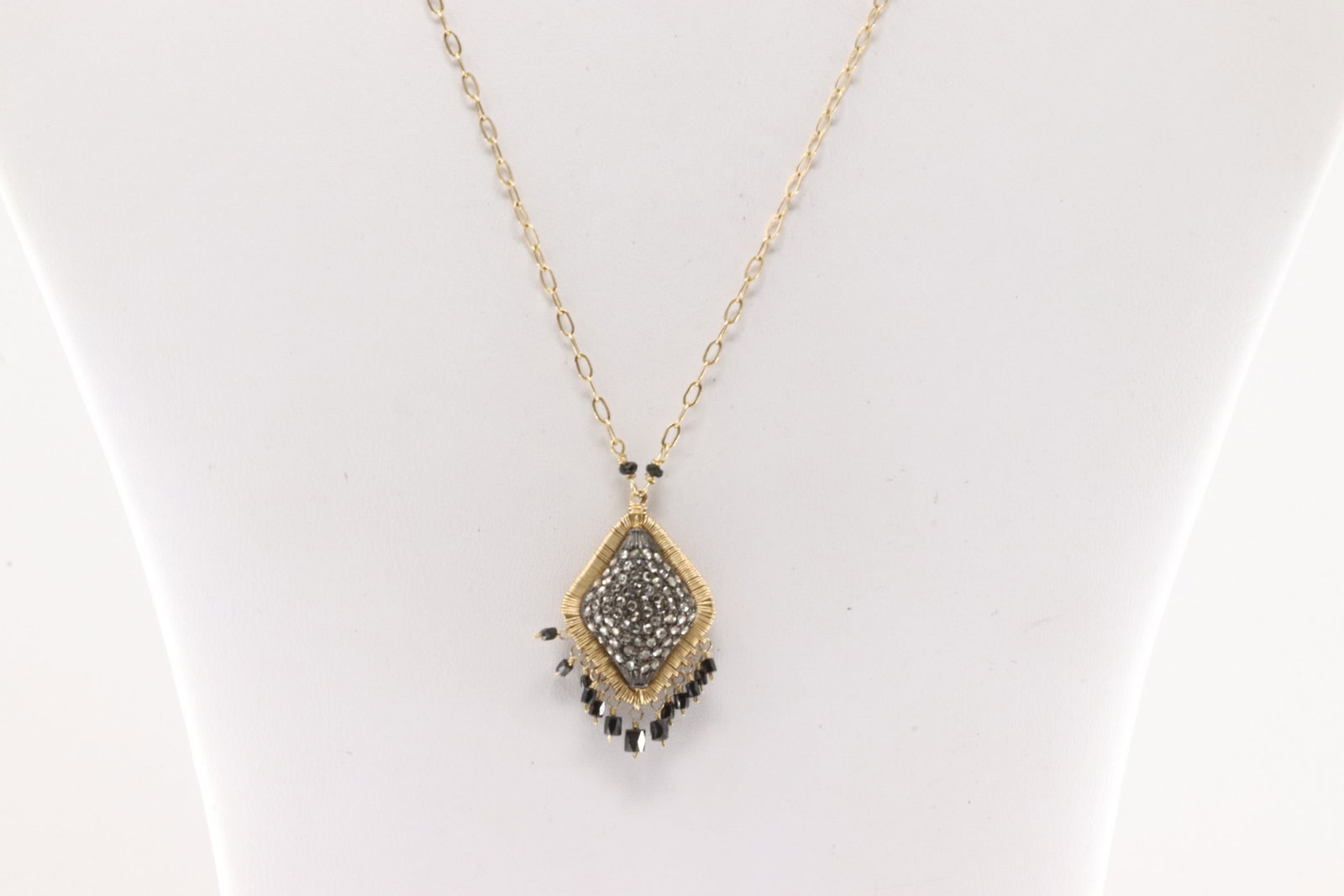 Black Onyx & Diamond Necklace 14Kt.: Ladies 14Kt Yellow Gold Black Onyx and Diamond Necklace. This elegant necklace has round champagne diamonds with black onyx gems. Diamonds weight approx: 2.00ctw. Necklace length: 20.00" Total