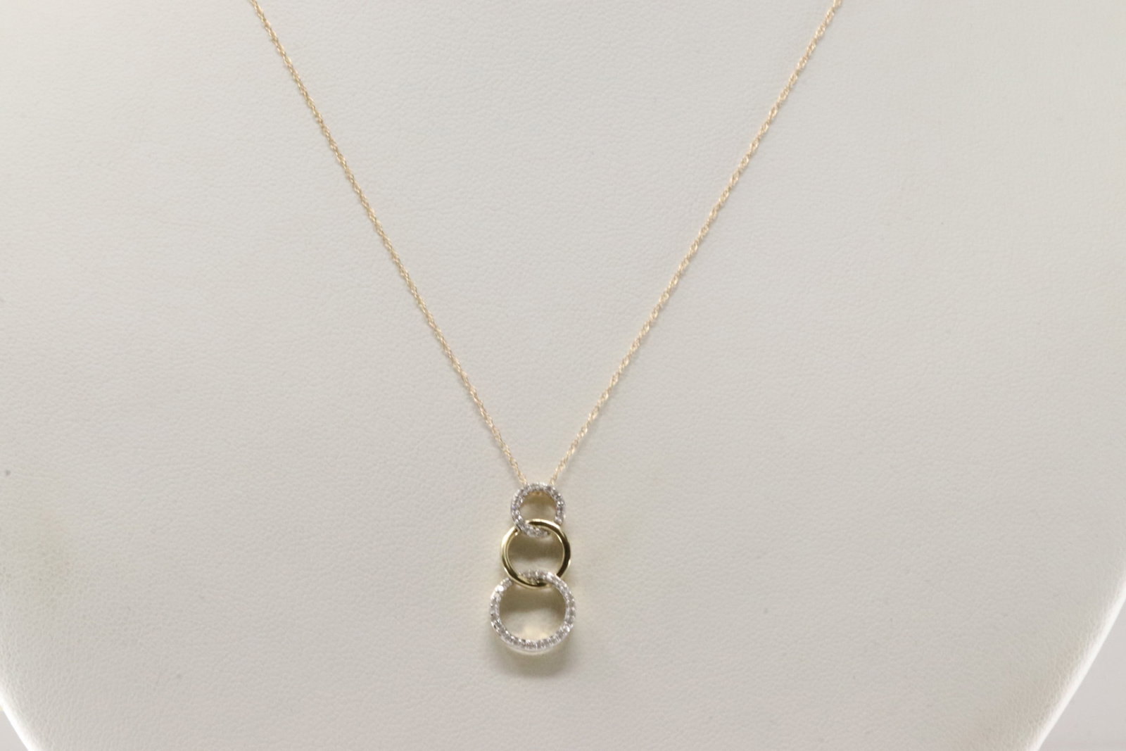 Diamond Pendant / Necklace 10Kt.: 10Kt Yellow Gold Diamond Pendant & Necklace. This Necklace has a Pendant with 3 Circles and Sparkling round Diamonds. Diamodns weight: 011ctw. Necklace length: 18.00"