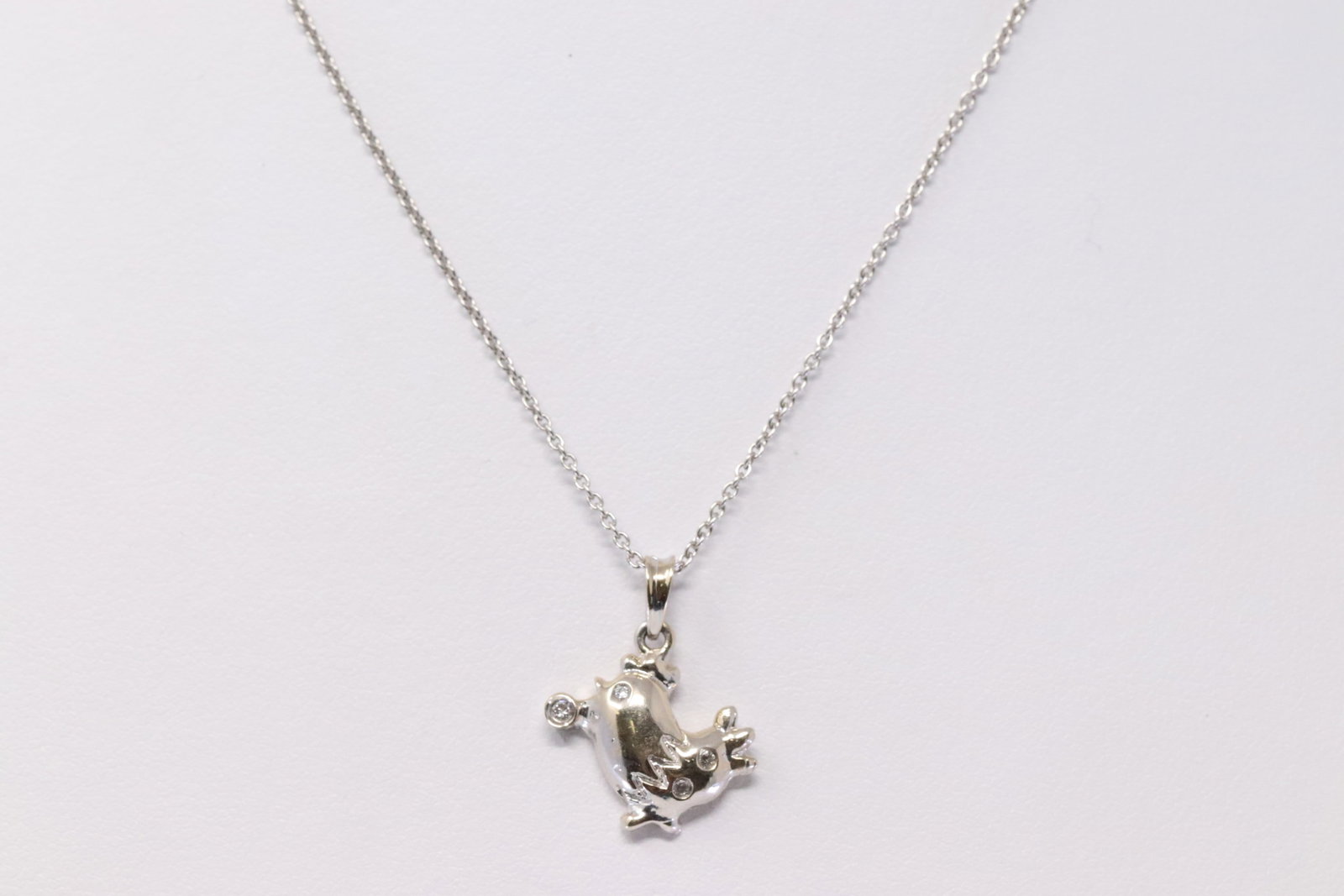 14kt White Gold Diamond animal Pendant.: 14Kt Ladies White Gold Diamond Animal Pendant. Pendant has 4 Diamonds & 14Kt Necklace. Necklace length: 16.00" Total weight: 3.45 Grams.HJ4CN5