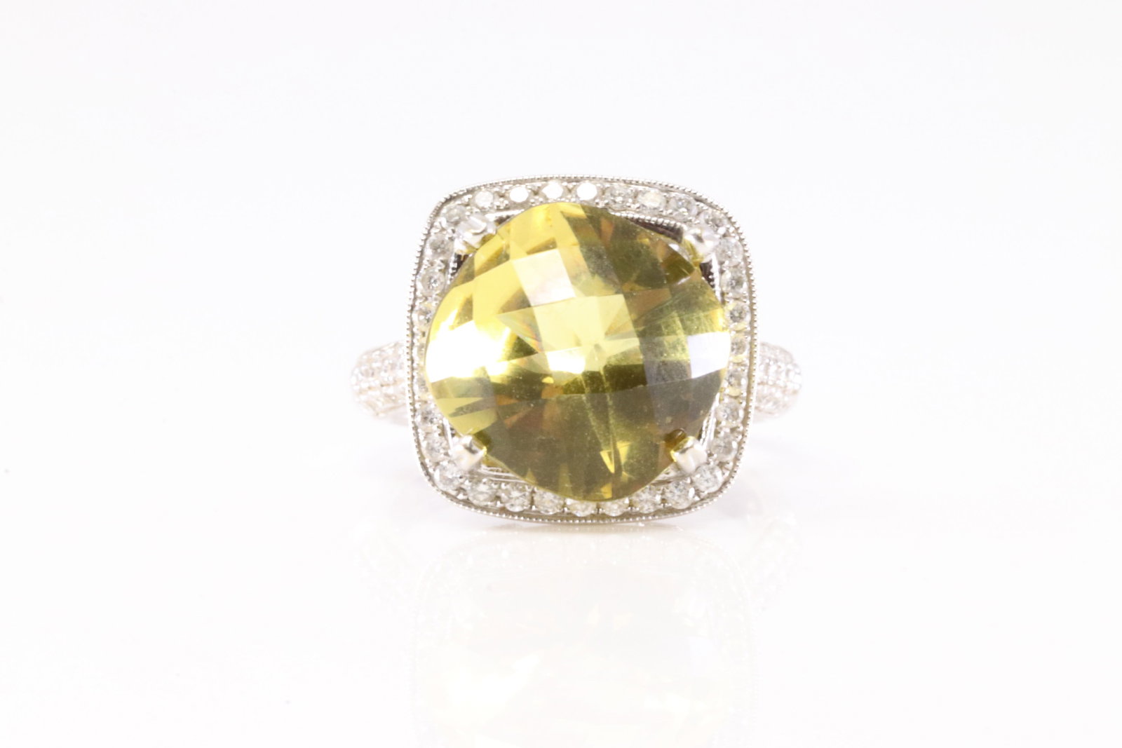 Elegant Citrine & Diamond Ring 18Kt.: Ladies 18 White Gold Citrine & Diamond Ring. This Elegant Ring has Citrine Gemstone Surrender By Brilliants Diamonds. Diamonds weight approx: 0.35 ctw Ring size: 6.75. Total weight: 8.58 Grams.