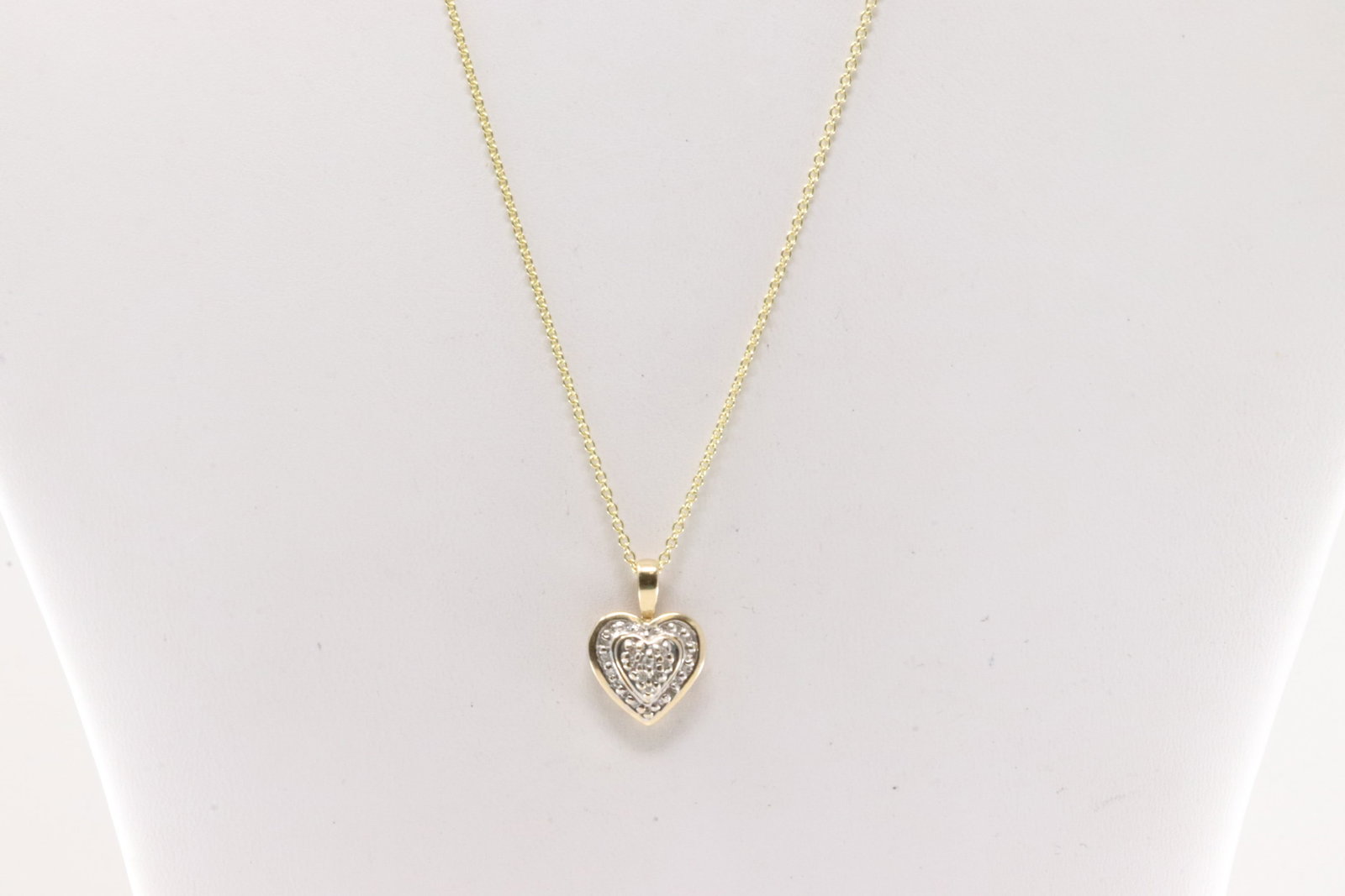 Diamond Heart Pendant / Necklace 10Kt.: 10Kt Yellow Gold Diamond Heart Pendant / Necklace. This pendant has heart-shape with 25 round diamonds and a 14k necklace. Diamonds weight: 0.45ctw. Necklace length: 18.00" 3.80 Grams.